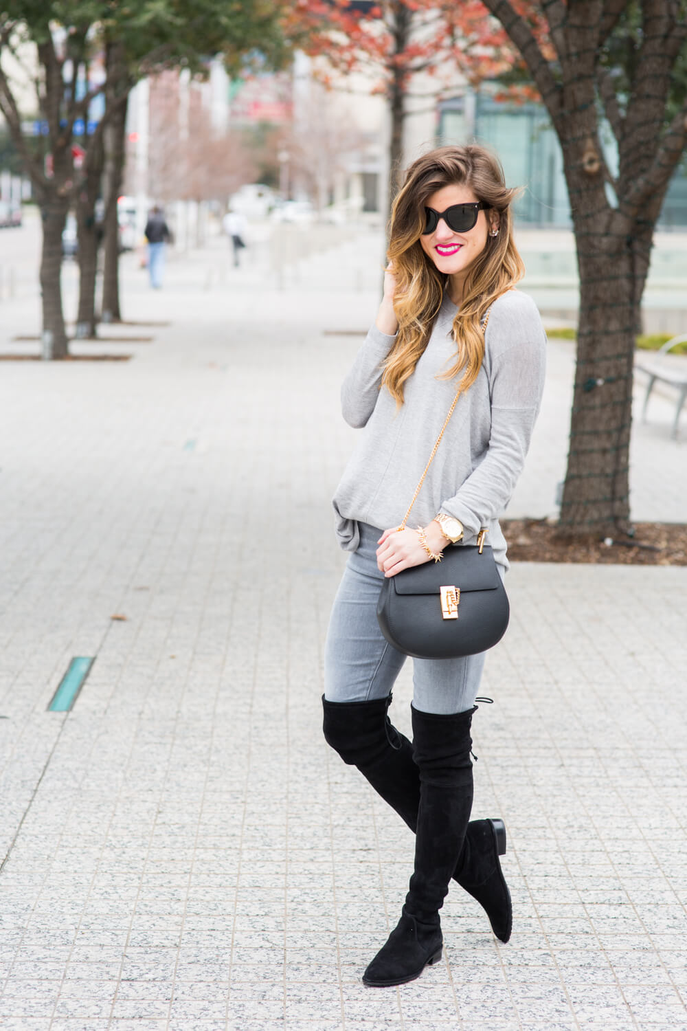 grey jeans with black boots