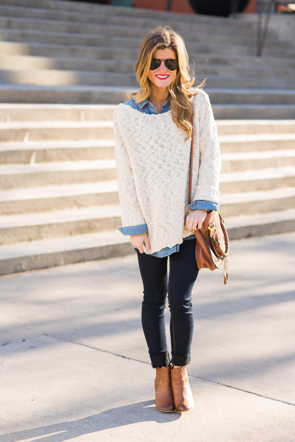 white sweater + chambray shirt + skinny jeans + booties + crossbody bag