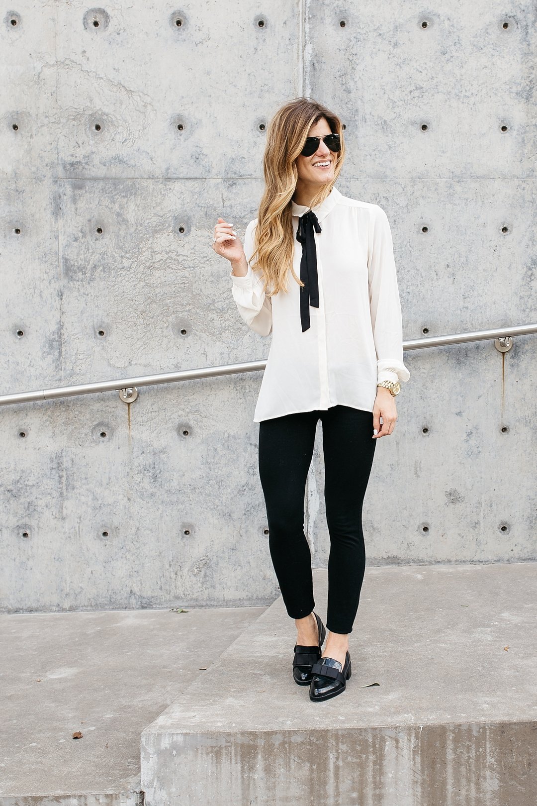 White floral blouse gray pants business casual with black cardigan