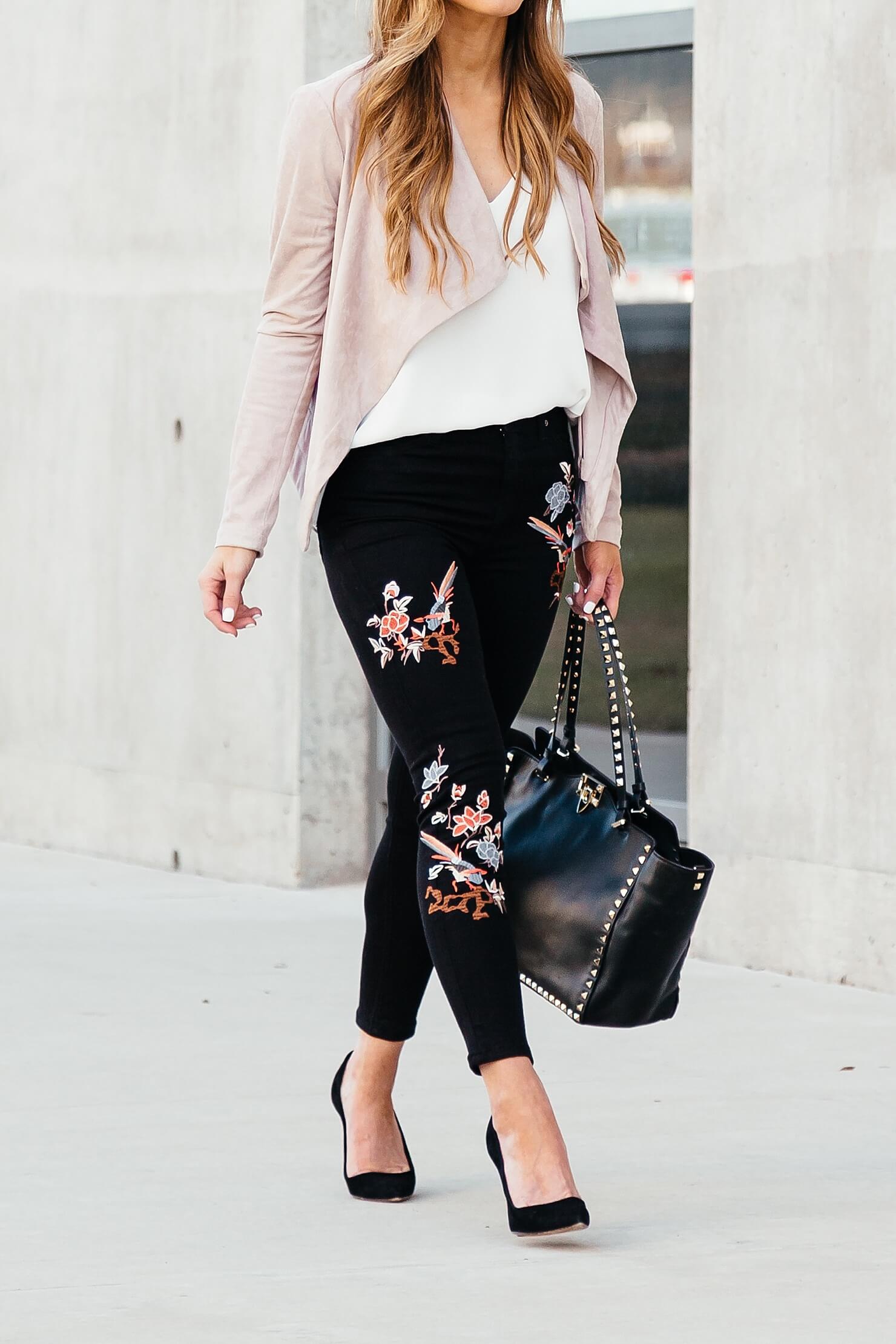 black jeans with floral embroidery