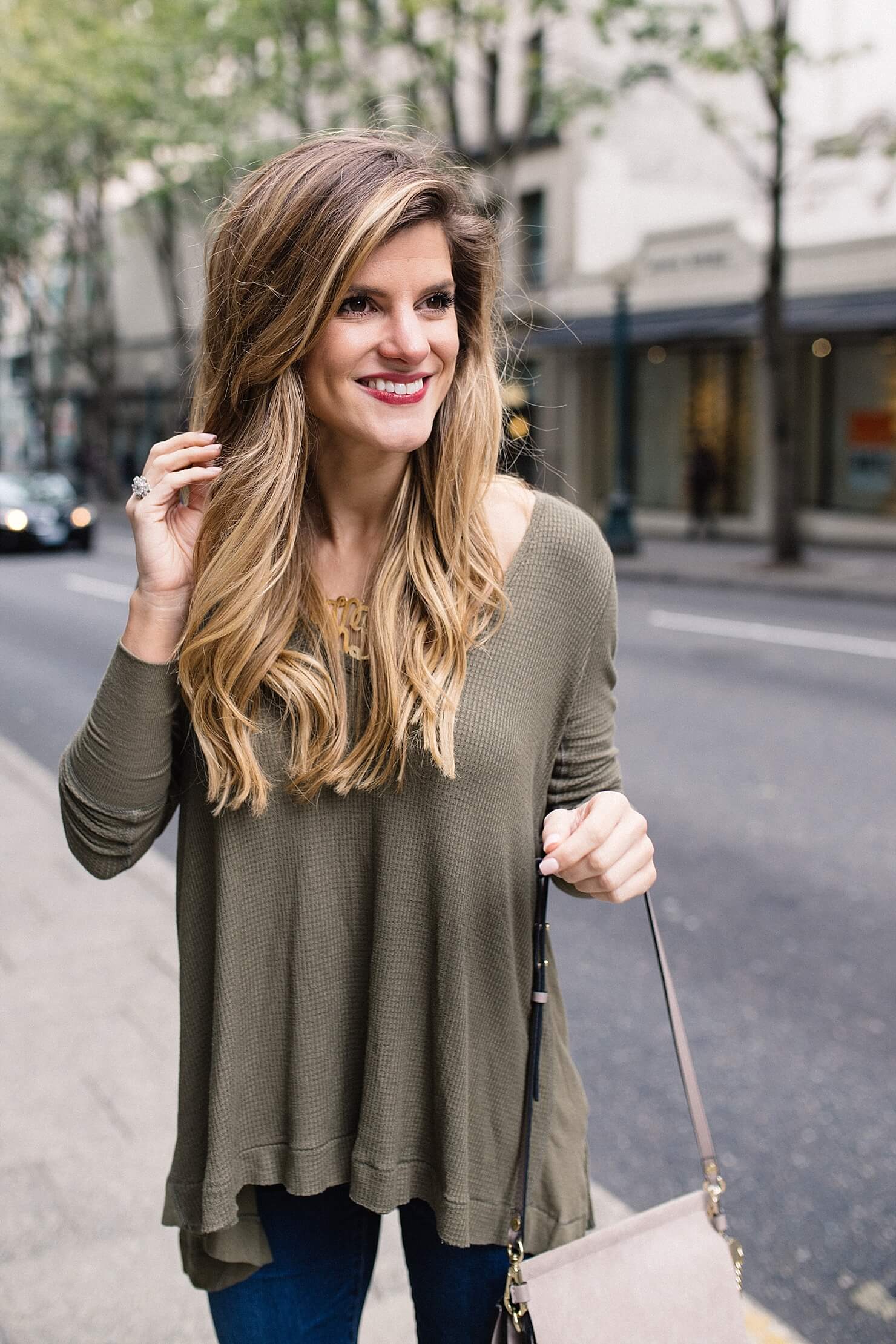 simple fall outfit idea, olive green long sleeve waffle tee, casual fall outfit, long sleeved tee and jeans, booties outfit, ankle booties look, fall simple outfit, jeans an booties, chloe faye handbag