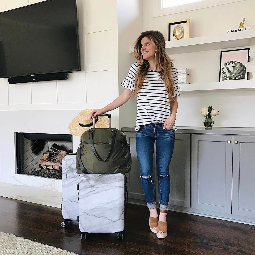 brighton the day travel outfit with distressed jeans and striped tee 