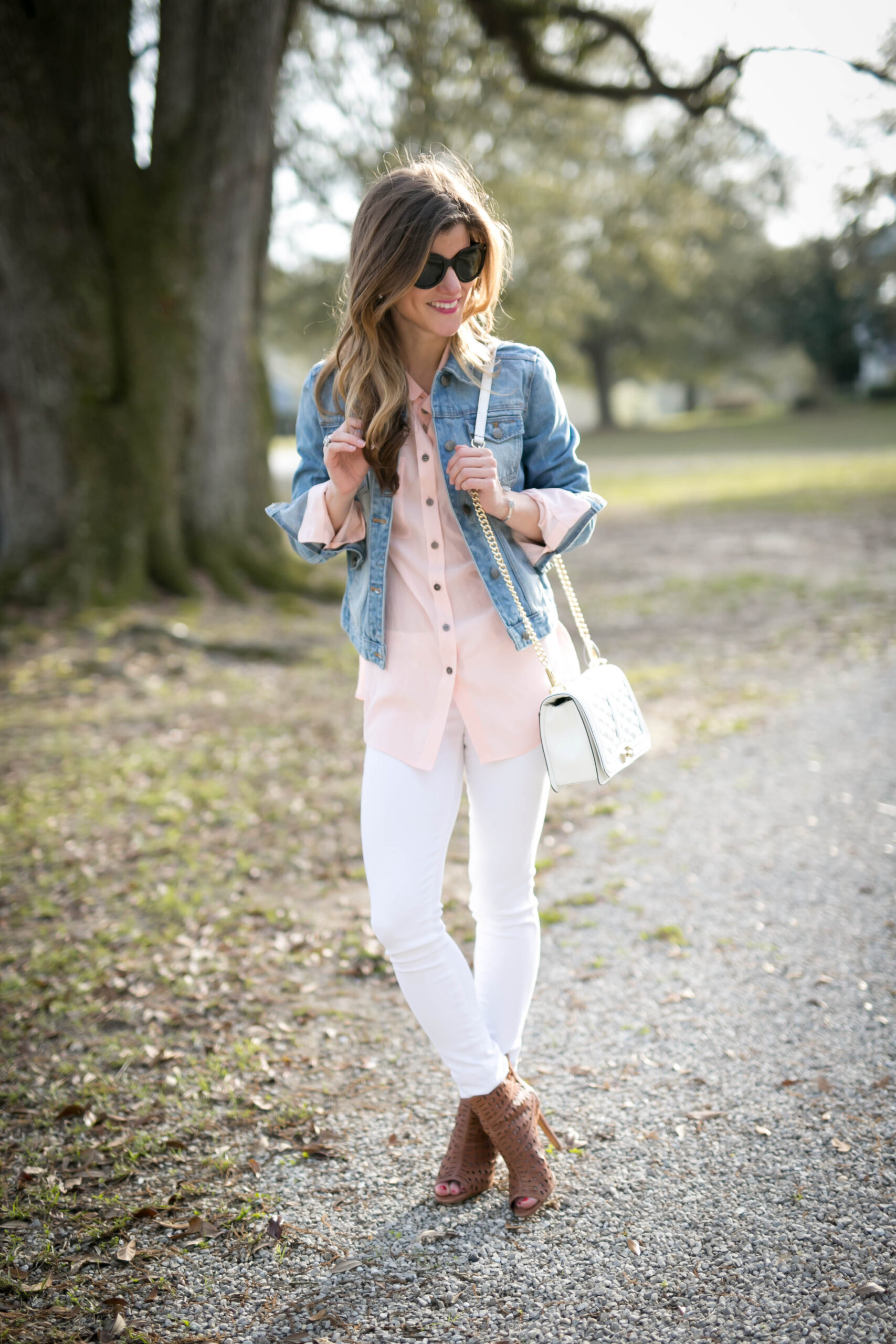 white jeans outfit, transitional outfit, white jeans and pastel pink blouse, silk button down blouse, denim jacket with white jeans, denim on denim, brown peep toe booties and white jenas