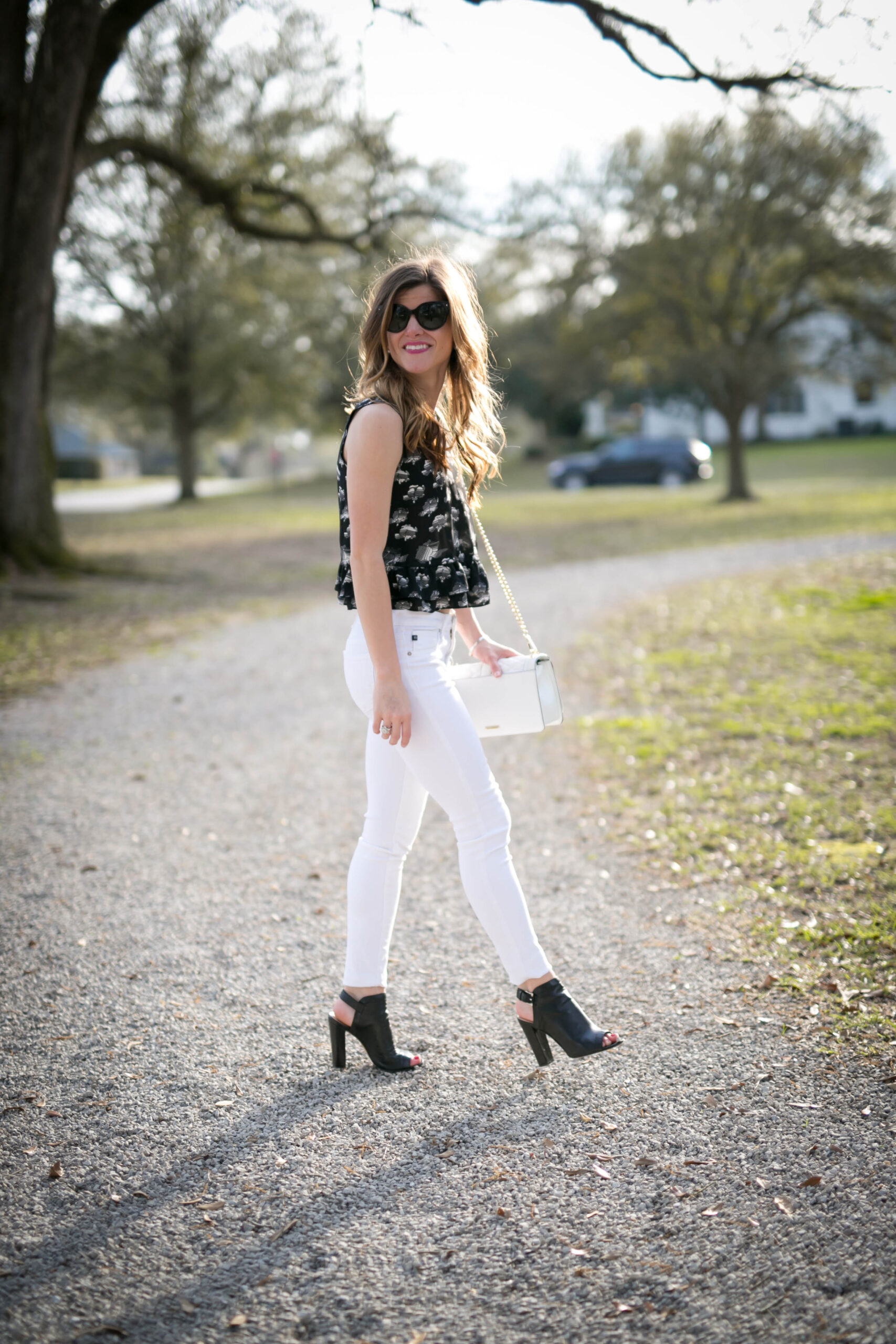 white jeans outfit, rebecca minkoff printed black peplum top, black peep toe sling back booties, fall outfit idea