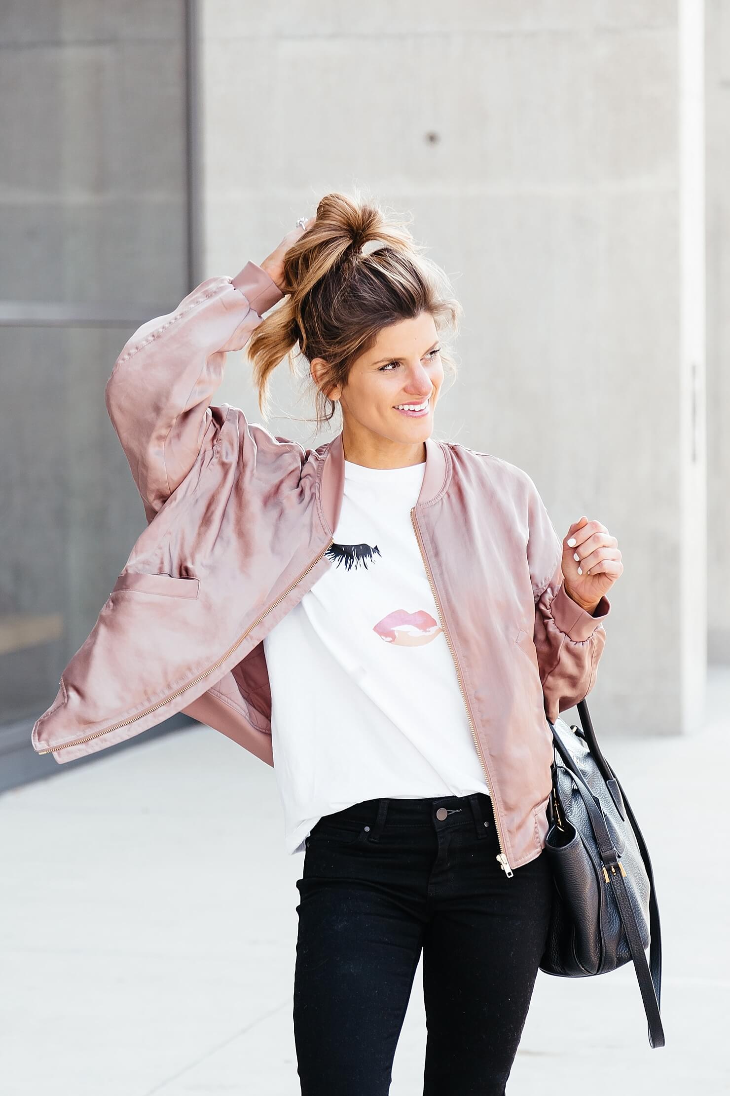 sincerely jules lips and lashes tee, leith pink bomber jacket, black jeans, casual everyday outfit, adidas gazelle sneakers