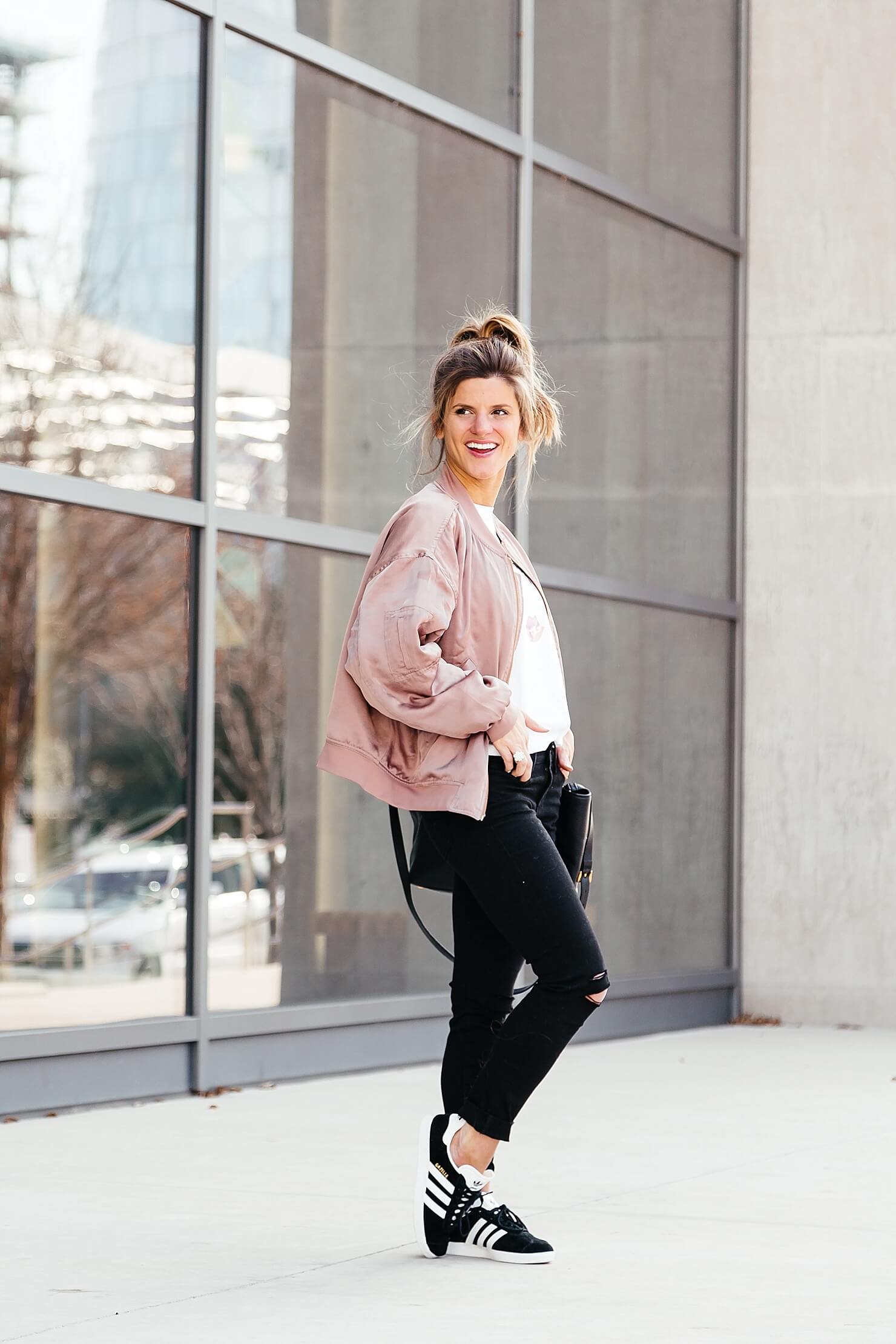 sincerely jules lips and lashes tee, leith pink bomber jacket, black jeans, casual everyday outfit, adidas gazelle sneakers