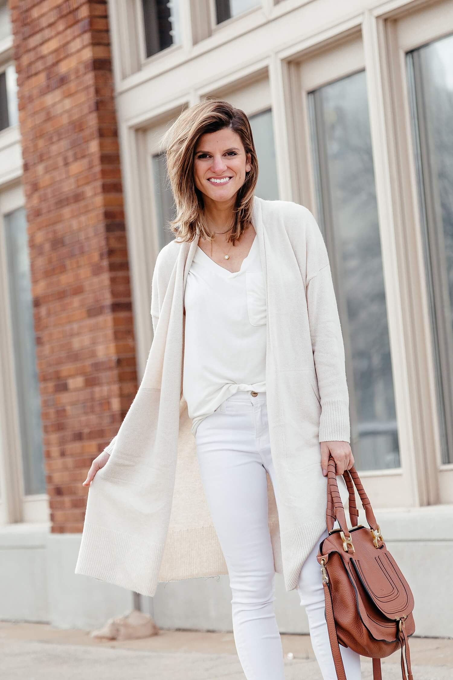 spring neutrals outfit with white jeans and cream cardigan