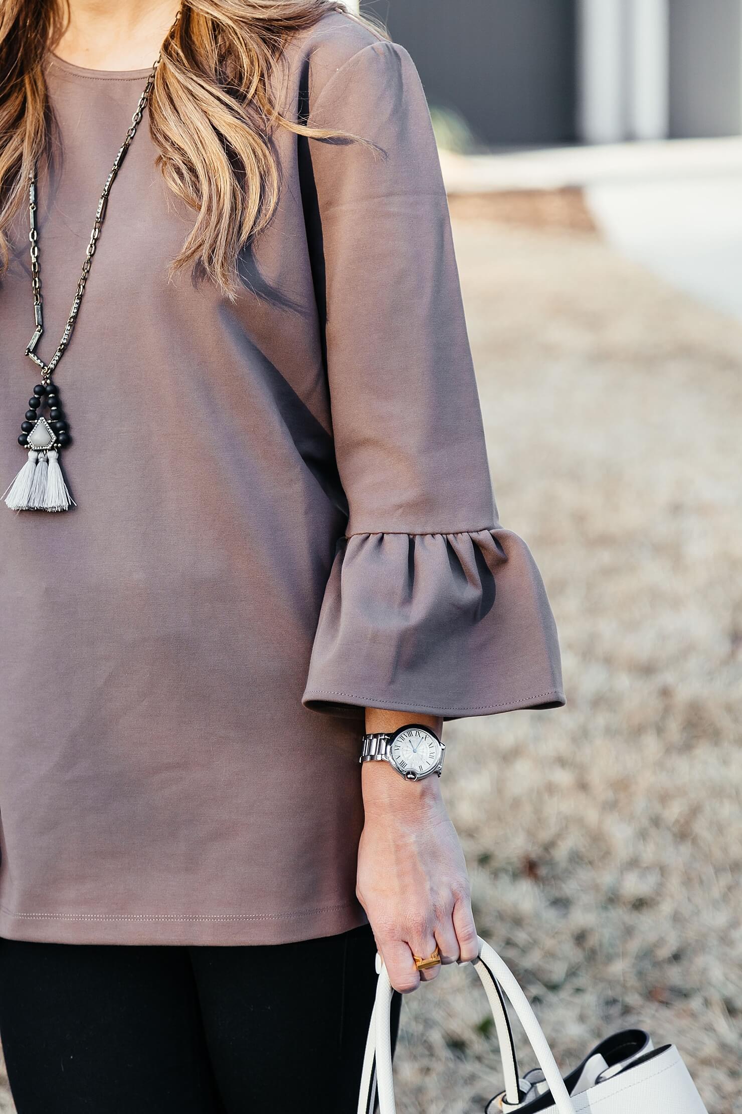 brighton the day peplum sleeve top with tassel necklace 