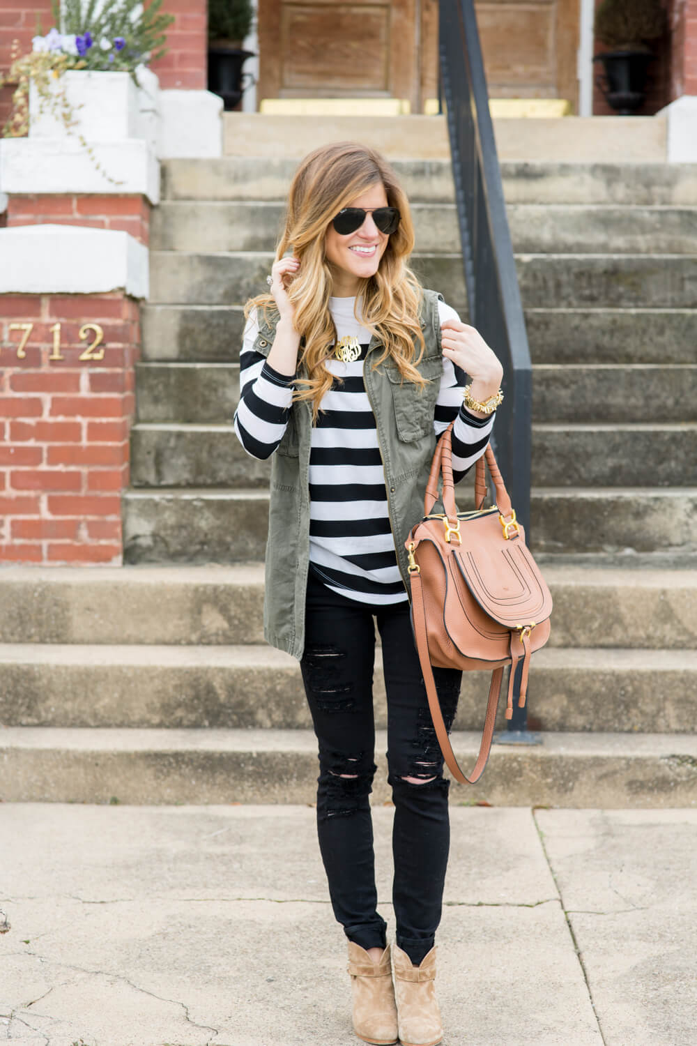 distressed black jeans + striped tee + military jacket