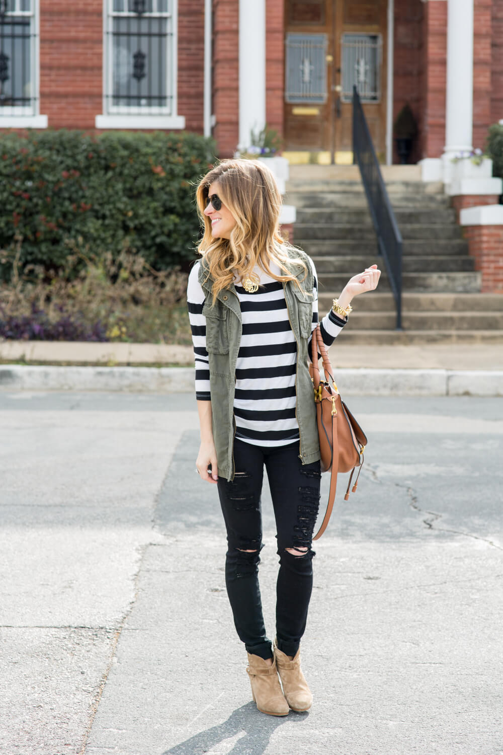 distressed black jeans + striped tee + military jacket