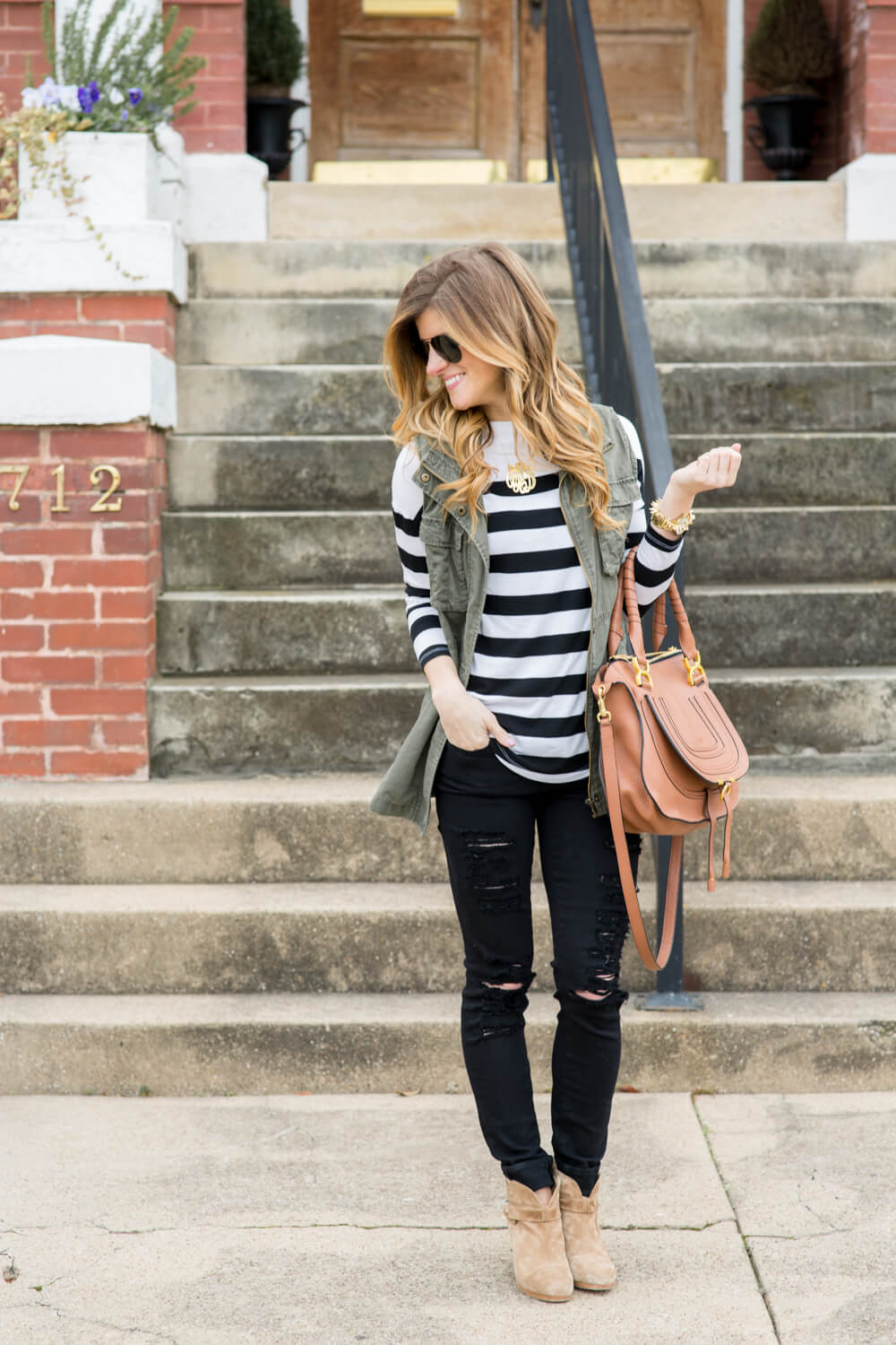 olive vest + black jeans