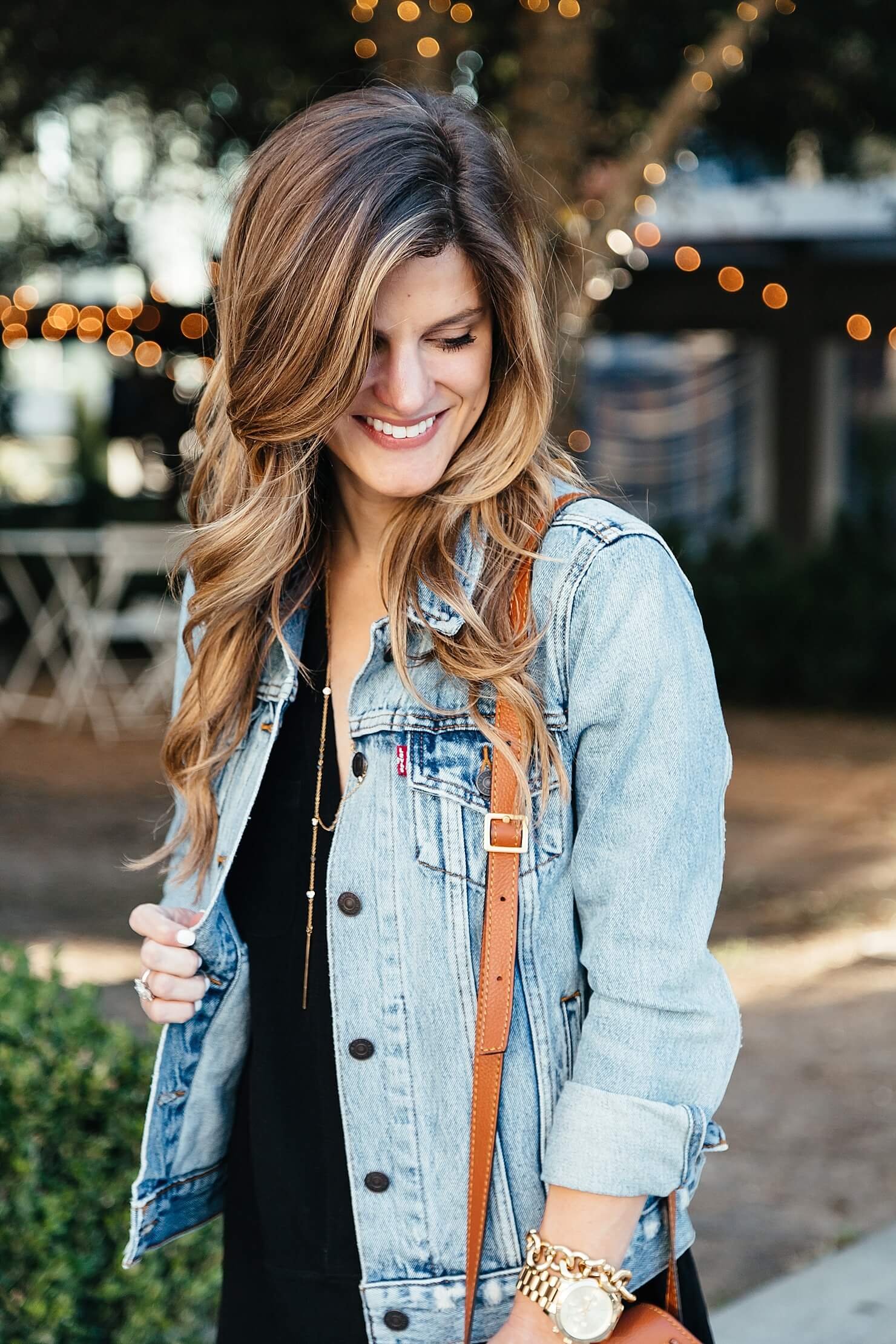 Levi's denim jacket, brunette balayage, gold accessories