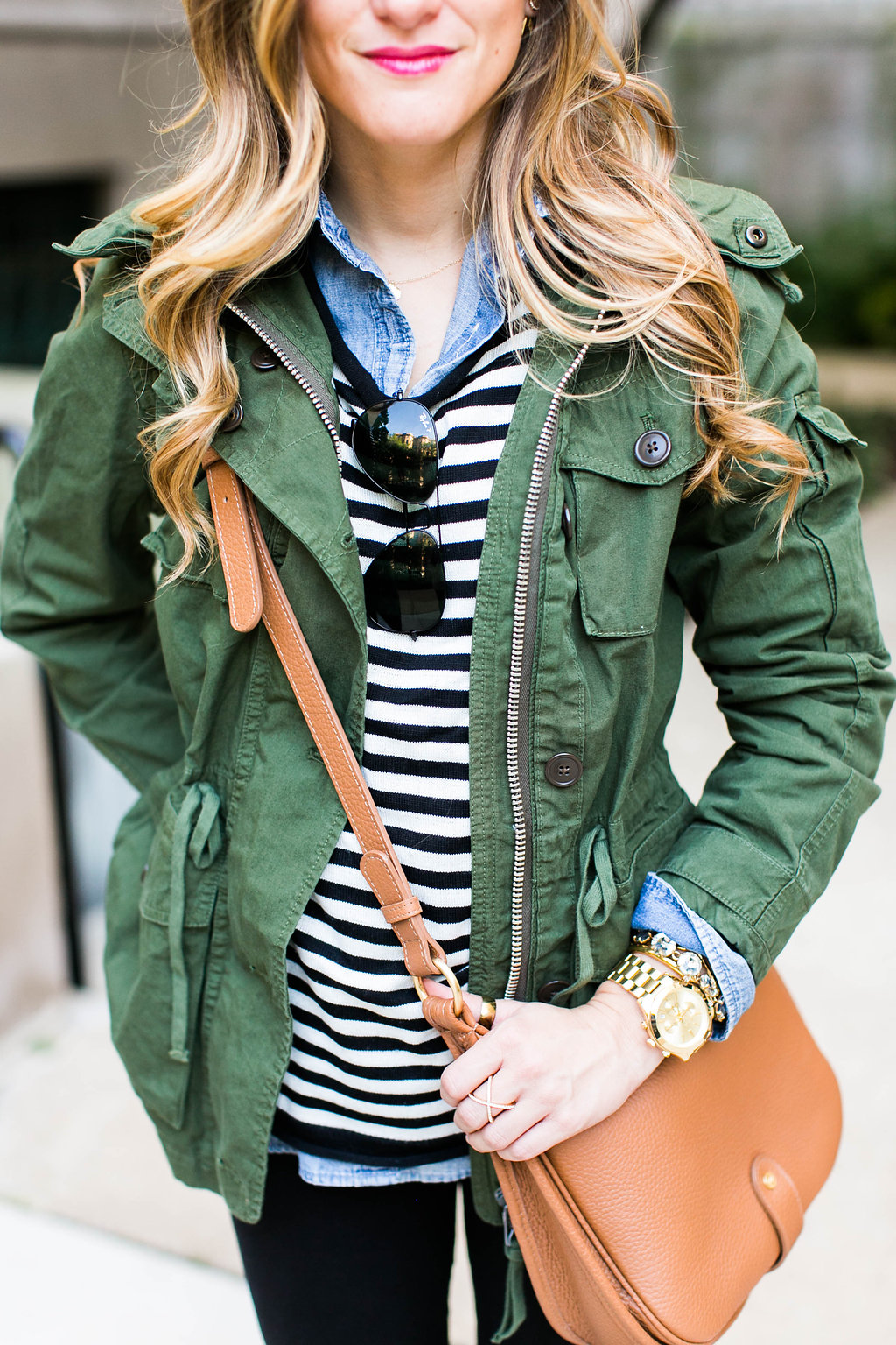 striped sweater, chambray, utility jacket, cognac leather crossbody, black jeans