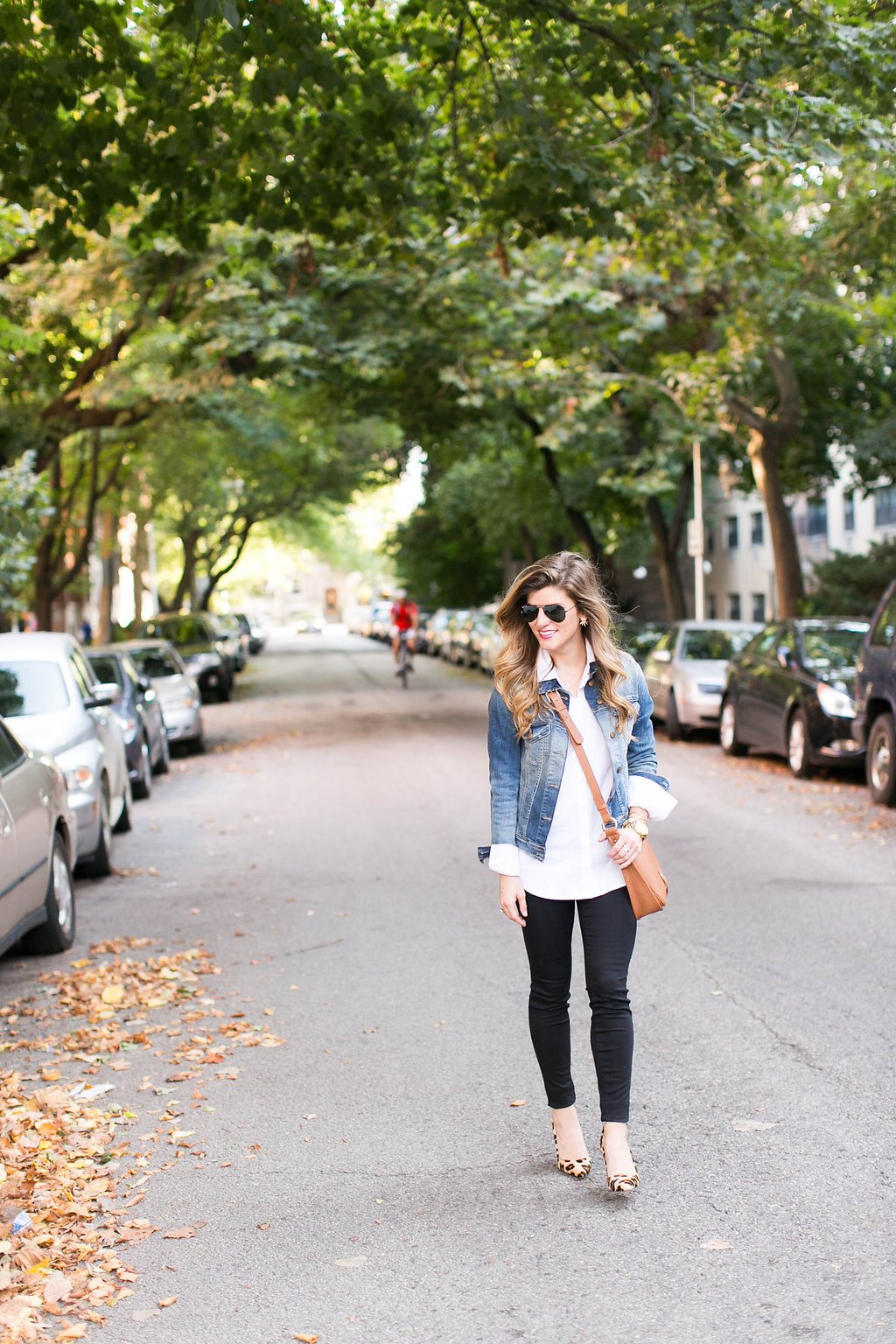 denim jacket and white button down and brown leather crossbody and leopard pointed toe heels