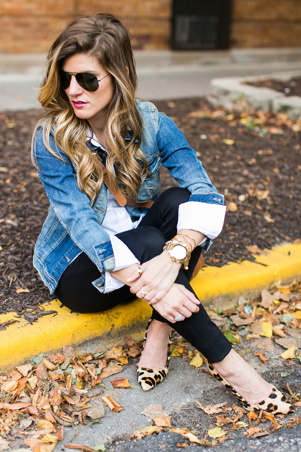 denim jacket and white button down and brown leather crossbody and leopard pointed toe heels