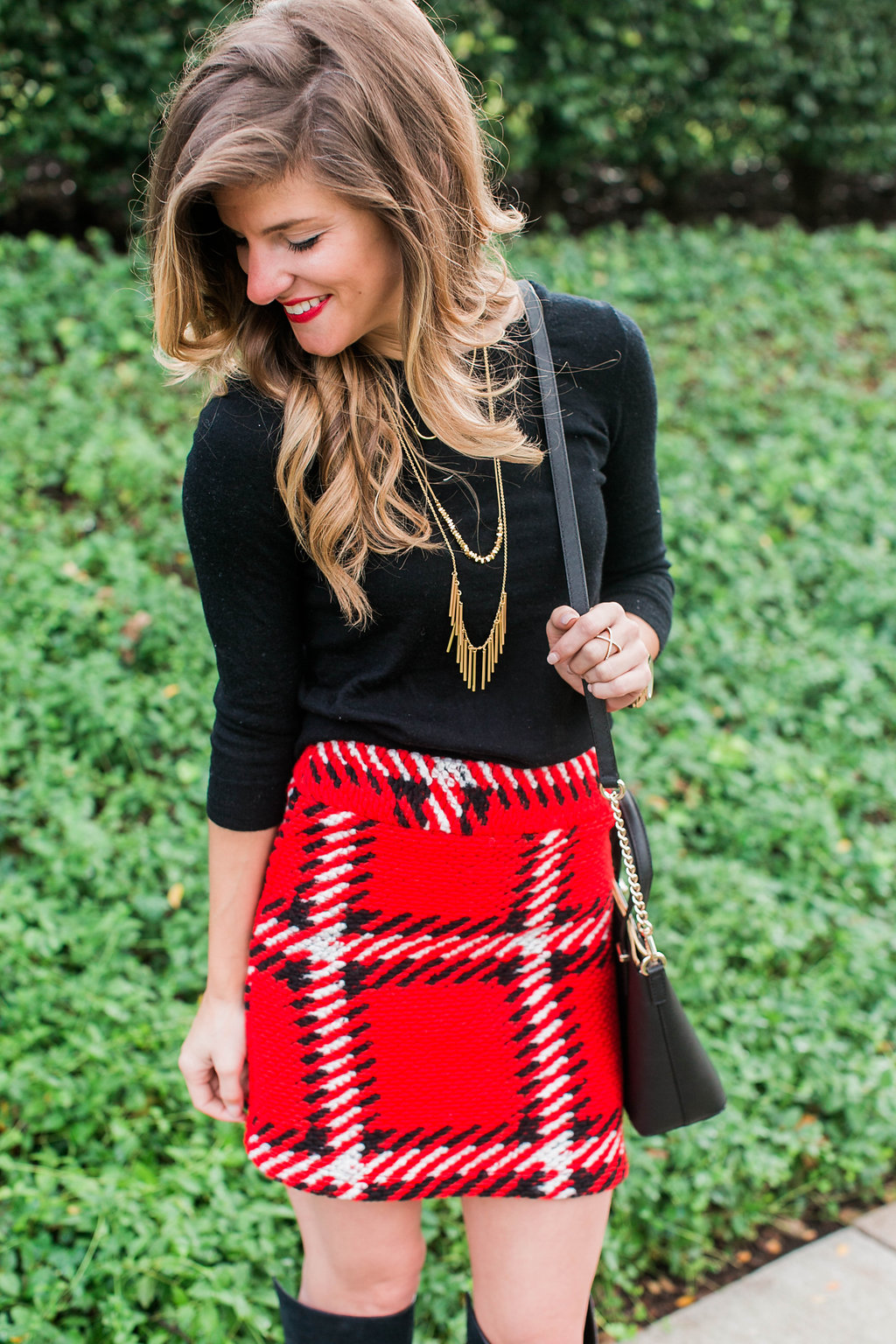 Red black plaid mini skirt with black sweater holiday outfit 