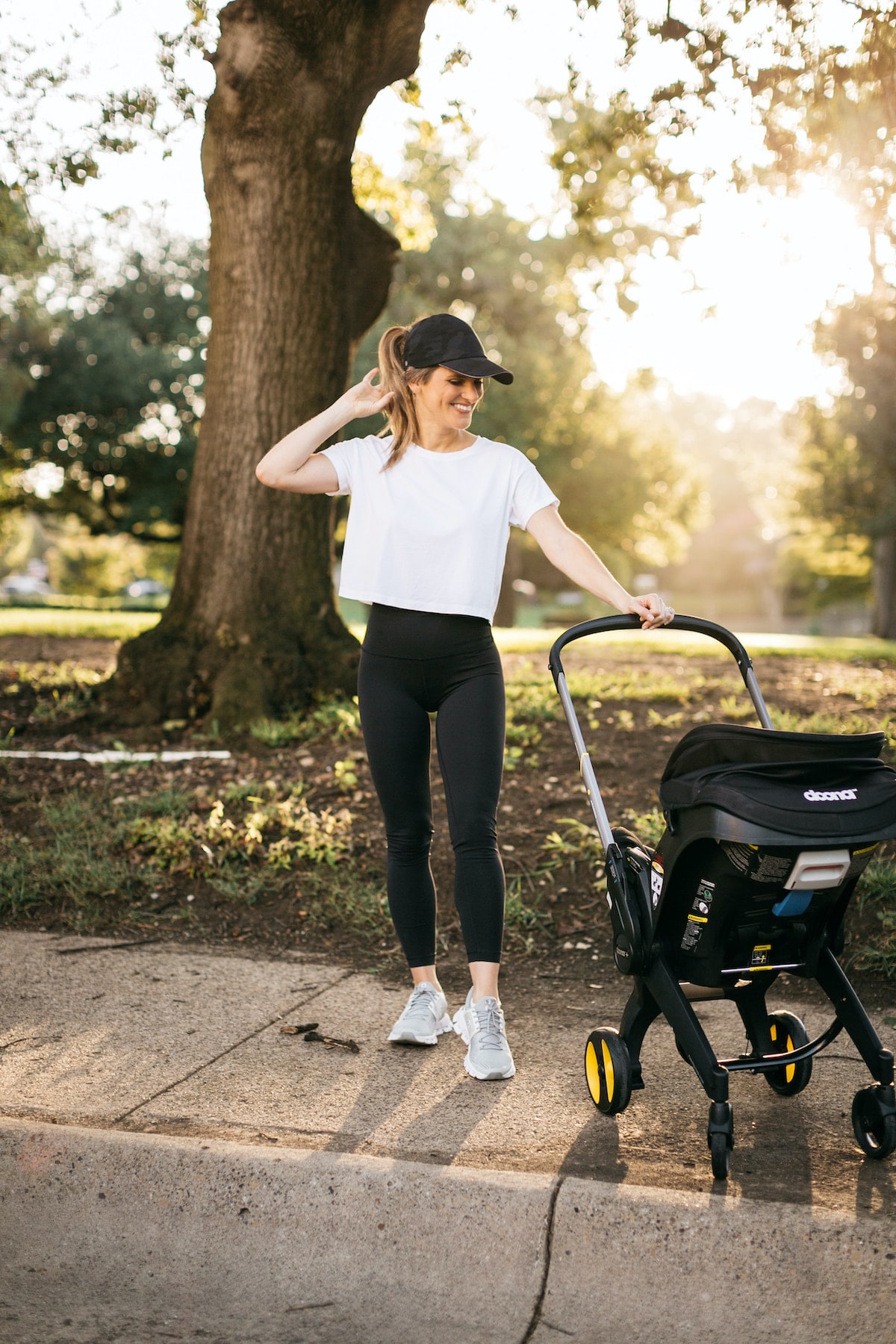 brighton butler doona stroller wearing lulu align leggings