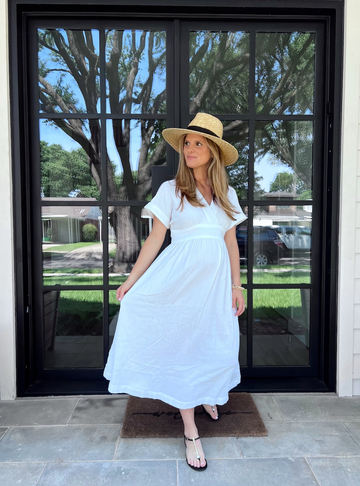 Brighton Butler wearing Hatch white dress with brixton straw hat 2