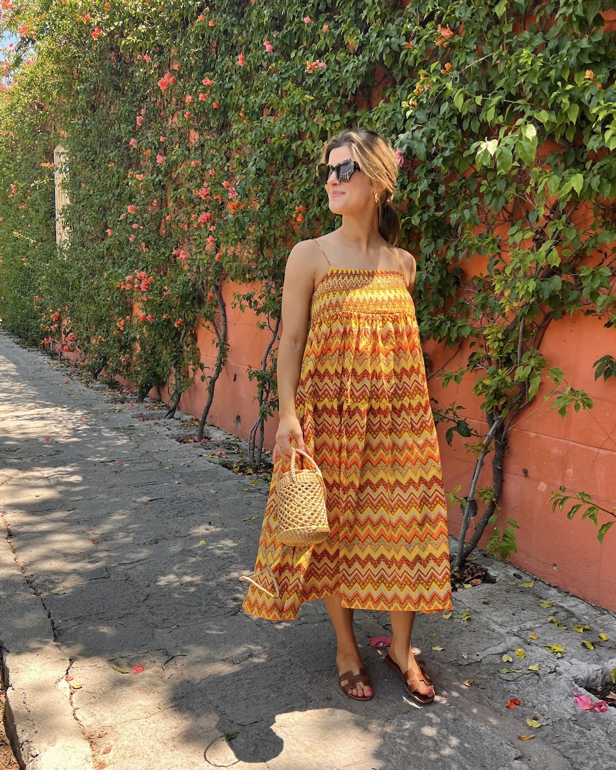 Brighton Butler wearing SWF orange and yellow midi dress san miguel mexico