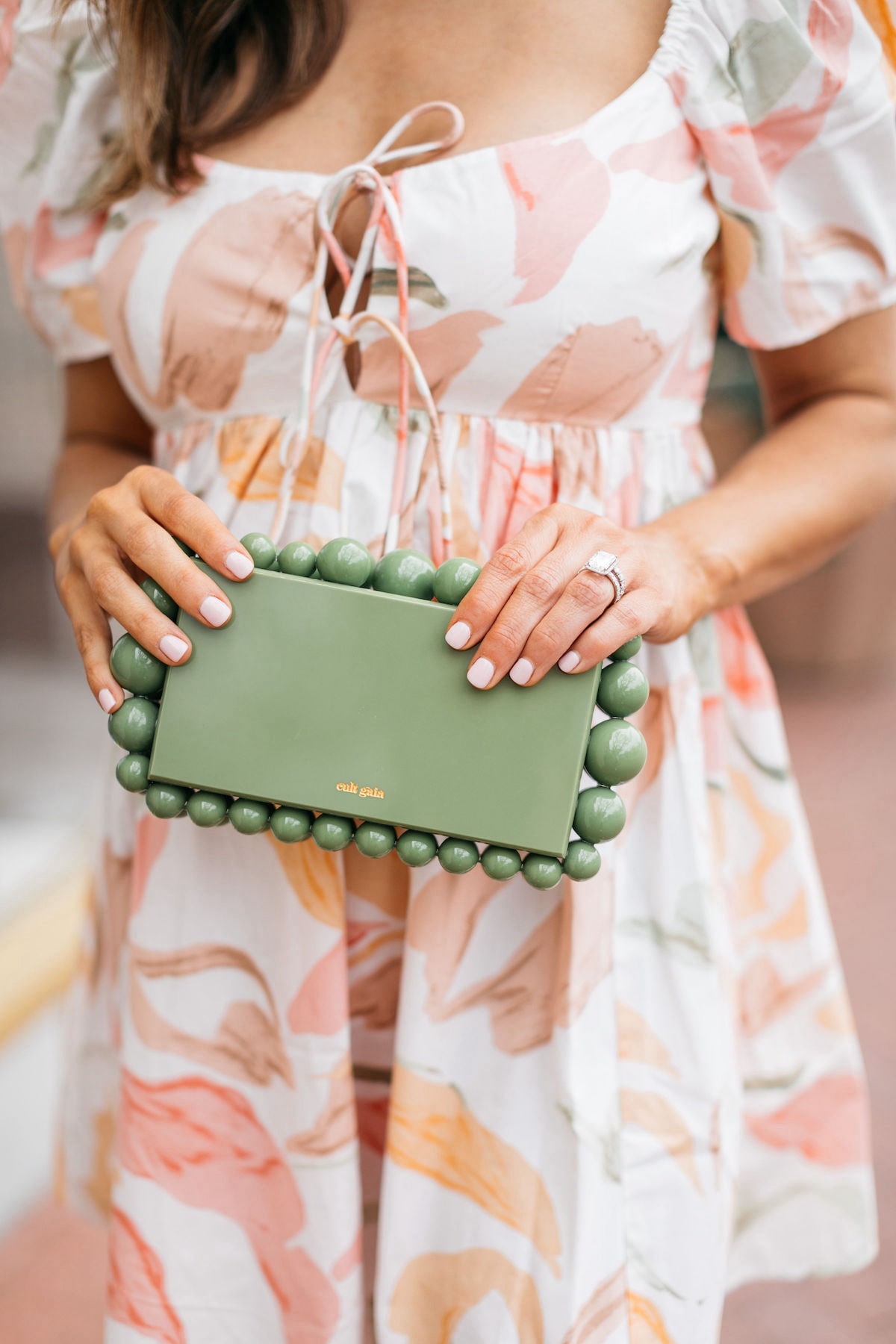 Brighton Butler wearing abercrombie mini dress with coral heels and cult gaia bag