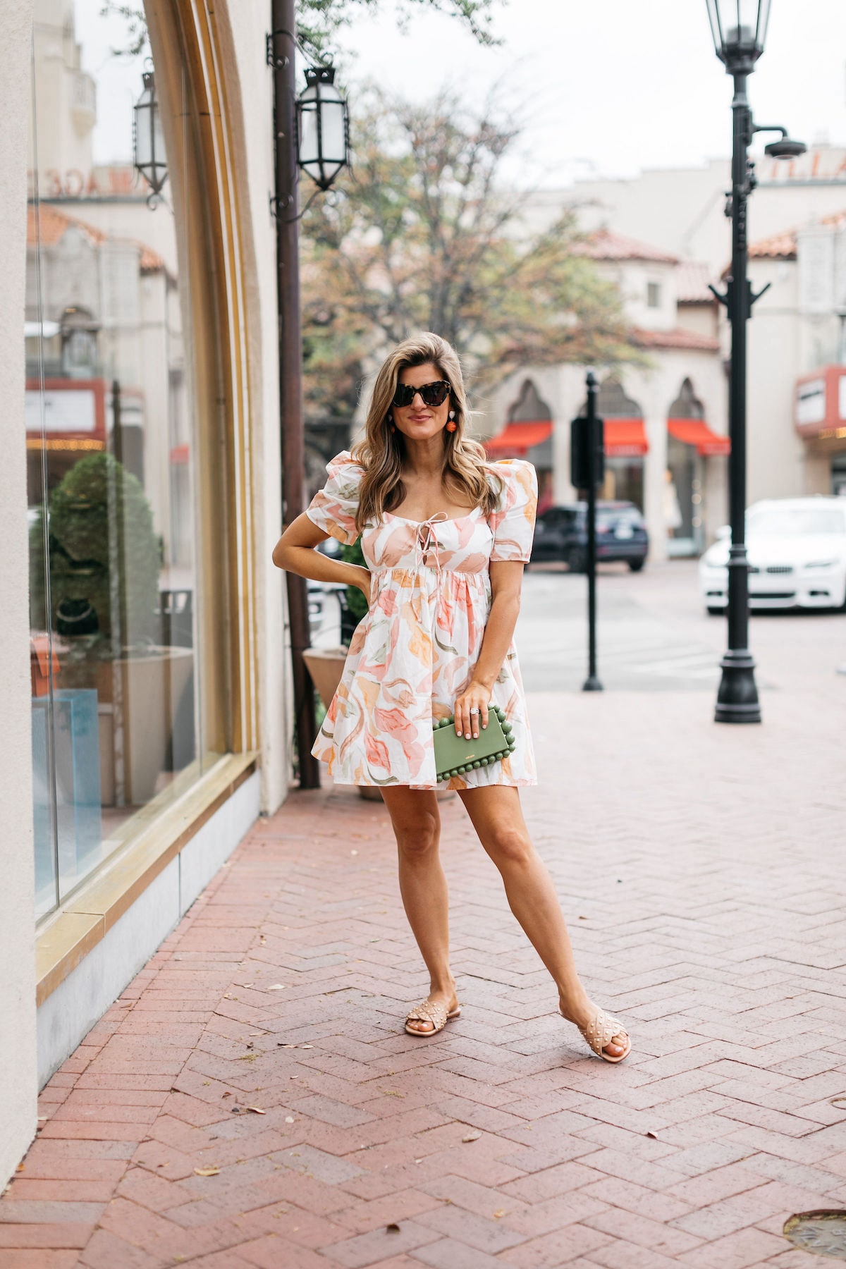 Brighton Butler wearing abercrombie mini dress with coral heels and cult gaia bag