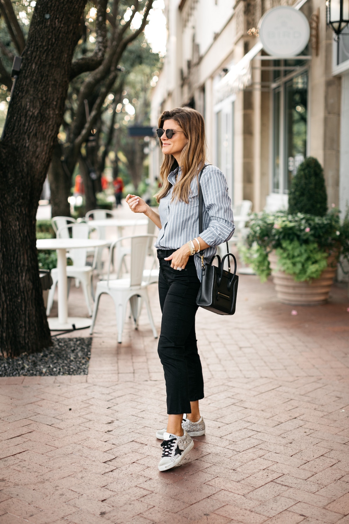 Brighton Butler wearing abercrombie striped shirt with black jeans and golden goose1