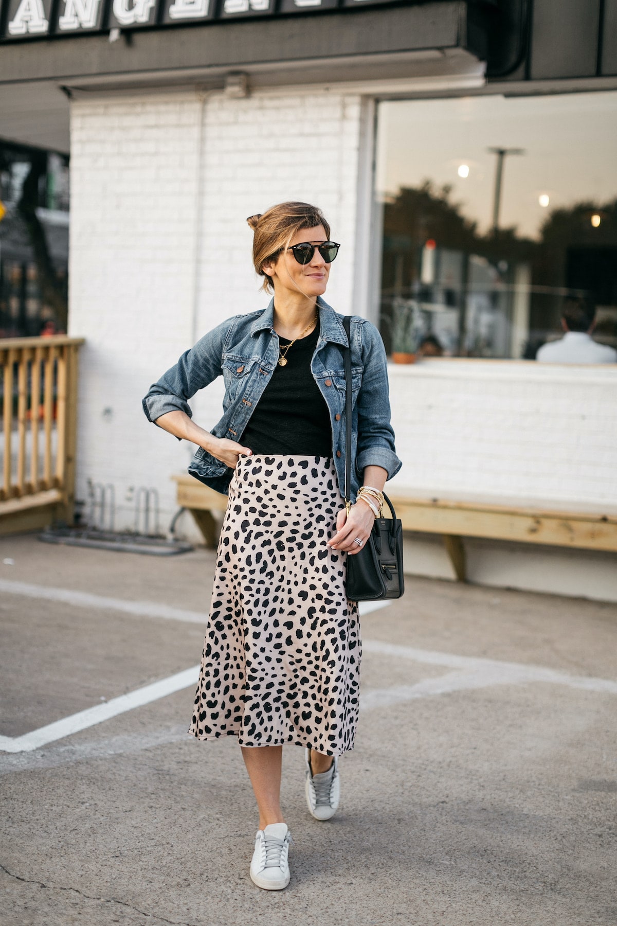 Brighton Butler wearing amazon leopard print skirt, madewell tee and jean jacket