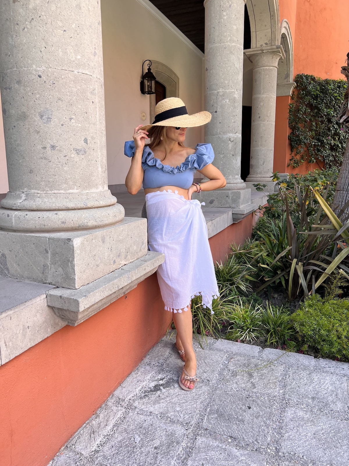 Brighton Butler wearing blue Mila ruffled swm with white sarong san miguel mexico