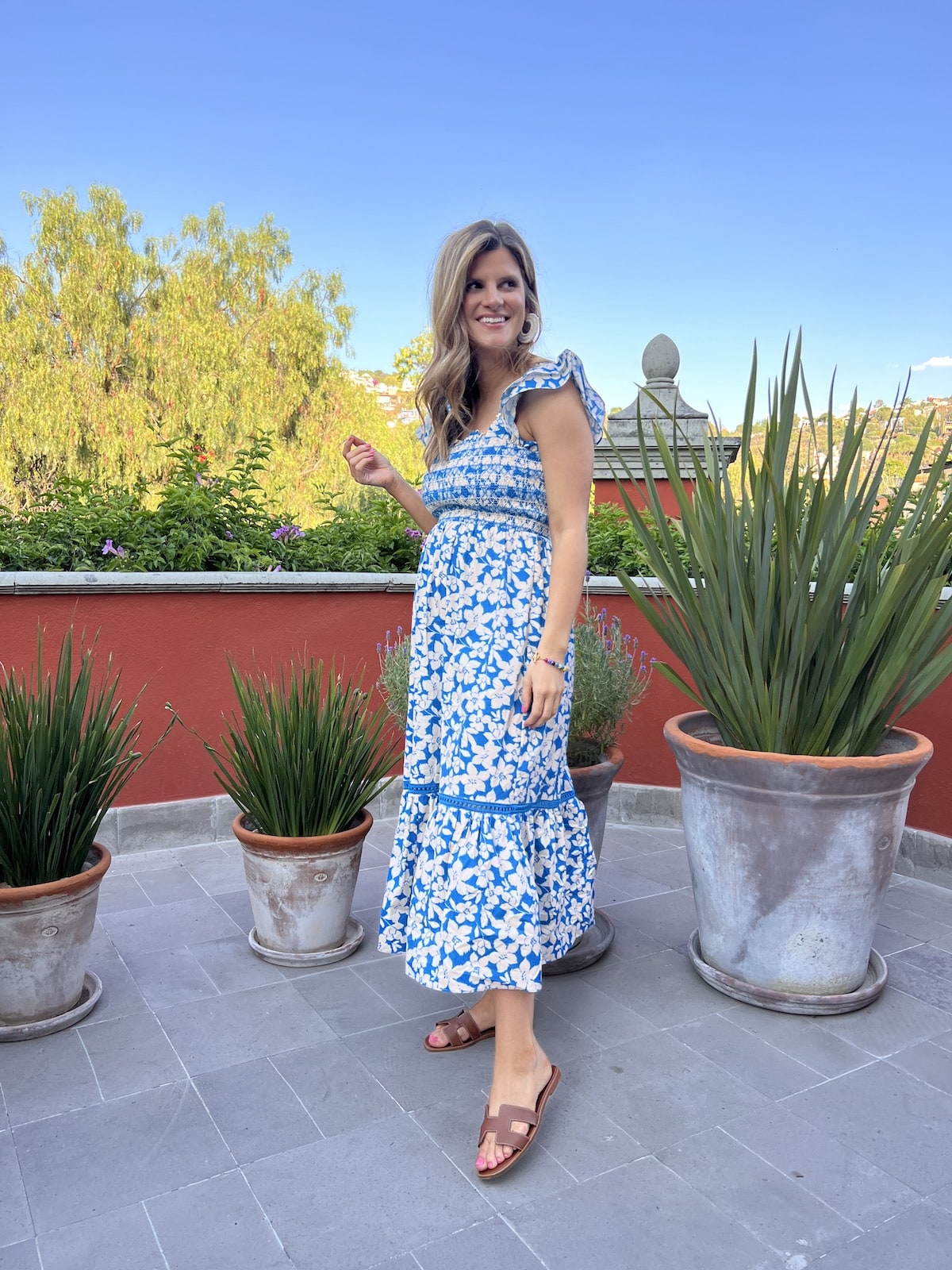 Brighton Butler wearing blue and white floral shoshana midi dress san miguel mexico