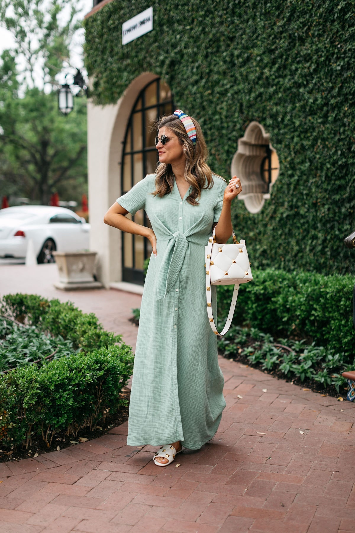 Brighton Butler wearing caslon green maxi dress with rainbow headband