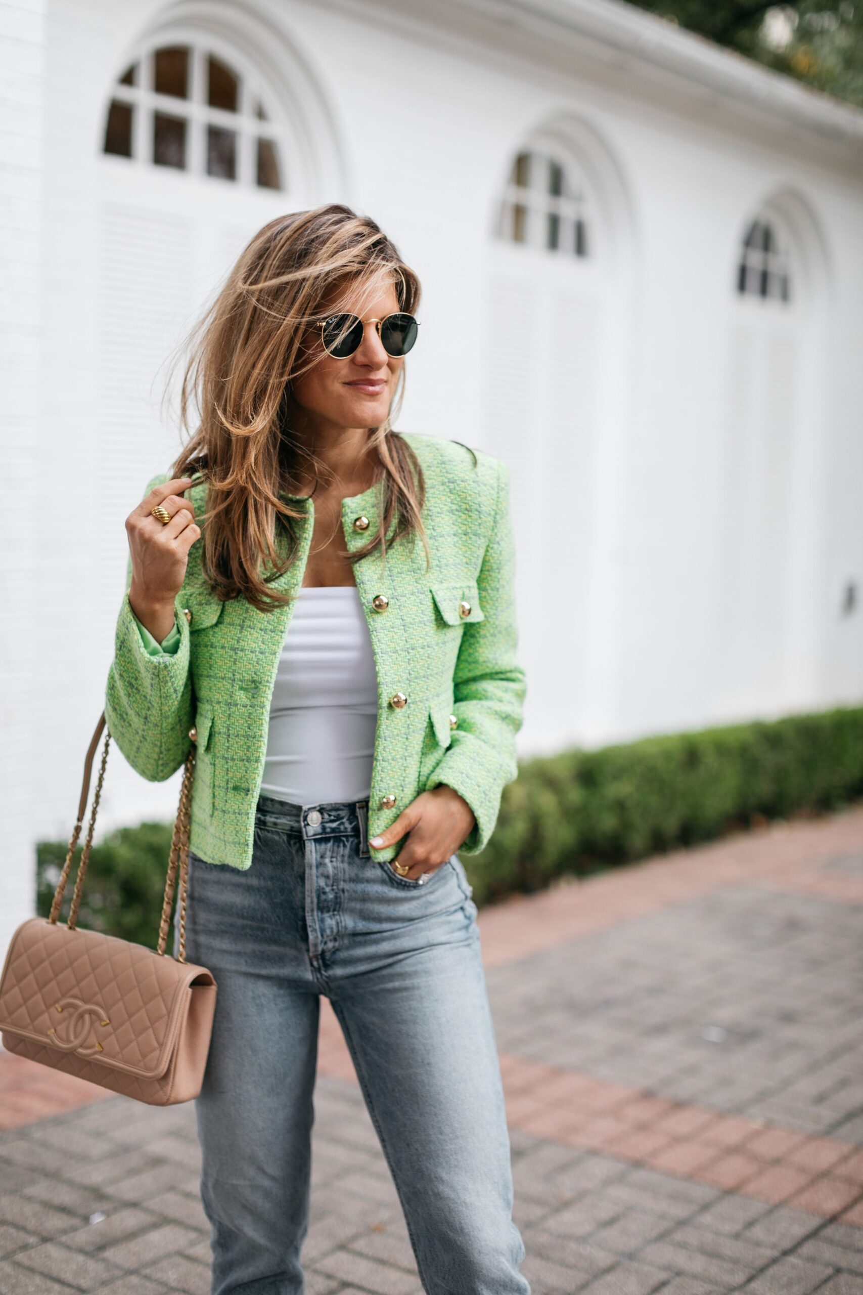 Brighton Butler wearing green spring jacket with lime green sandals