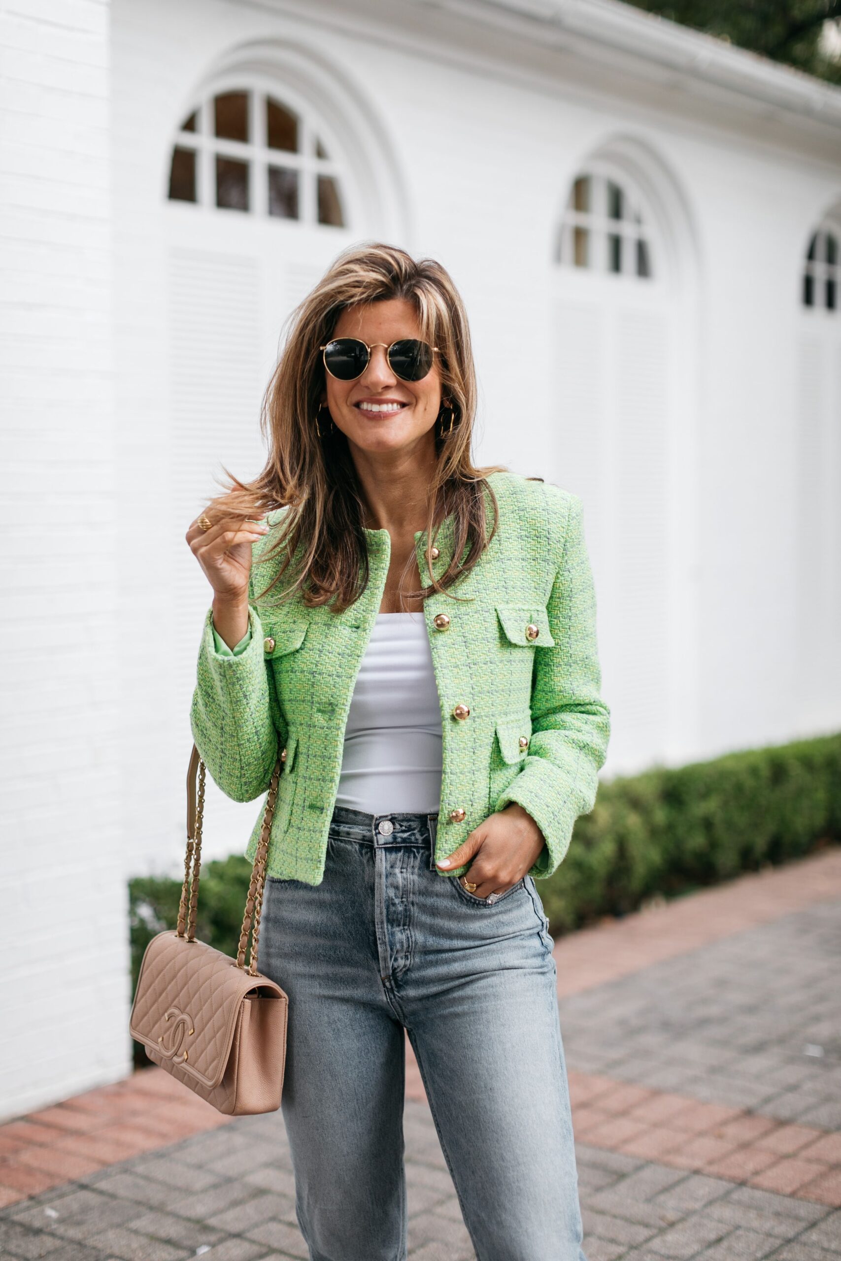 Brighton Butler wearing green spring jacket with lime green sandals