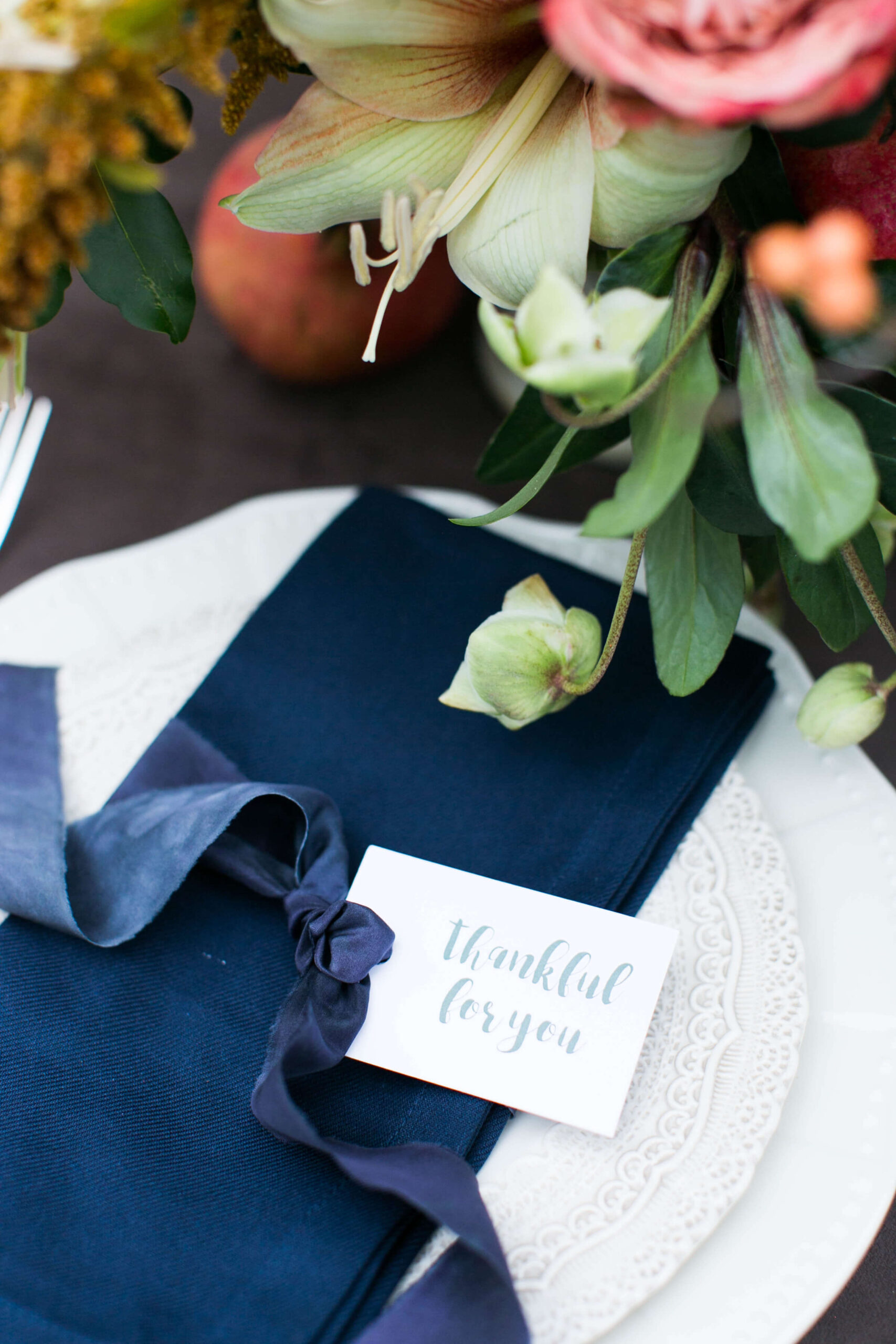 close up of friendsgiving/thanksgiving table decor and place settings