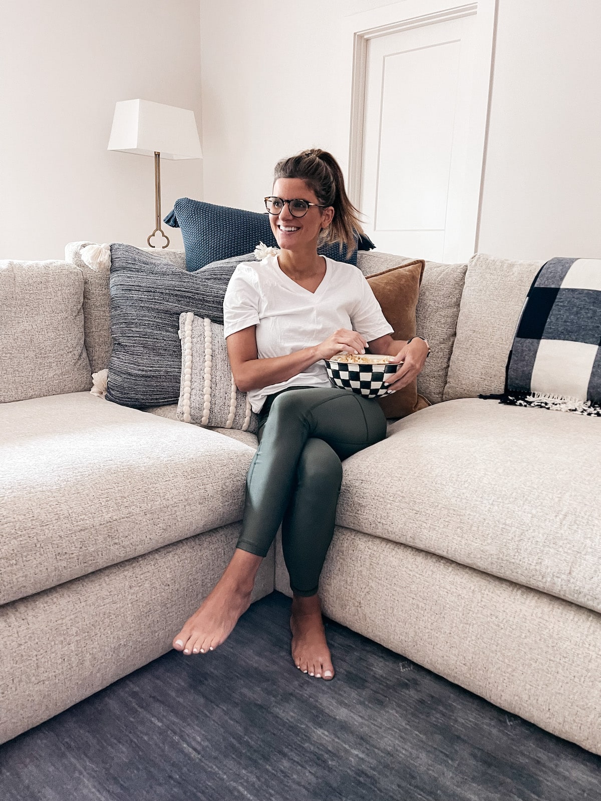 Brighton Butler wearing jockey green leggings with white v neck