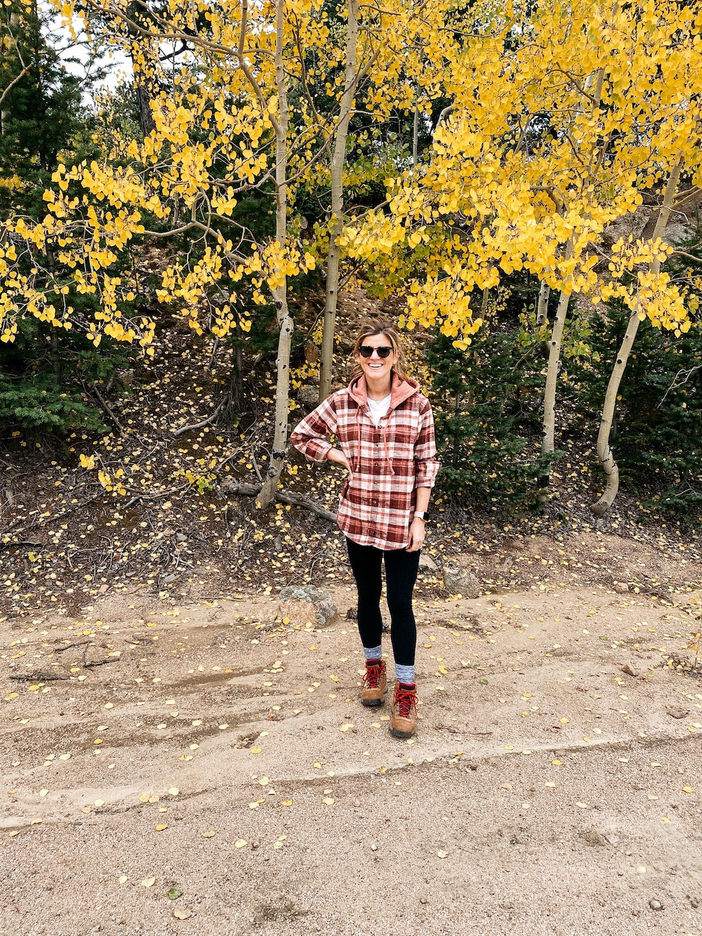 brighton butler wearing plaid shirt with hiking boots, hiking outfit, hiking boots