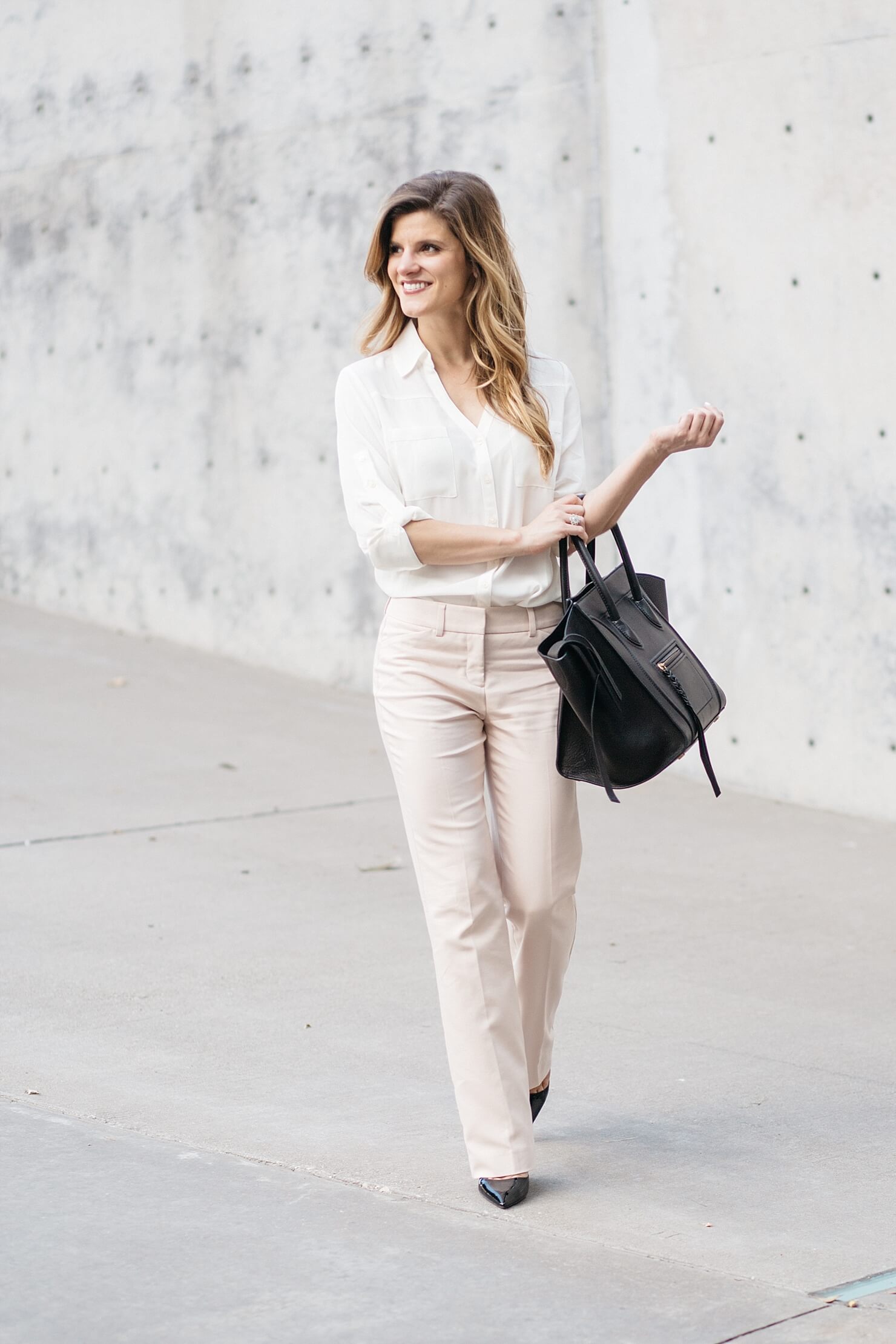 business casual outfit, express editor barely bootcut pants, blush pink pants with off white blouse, express work clothing. business casual outfit idea, prada black patent pumps, black pumps with blush pants, celine phantom bag