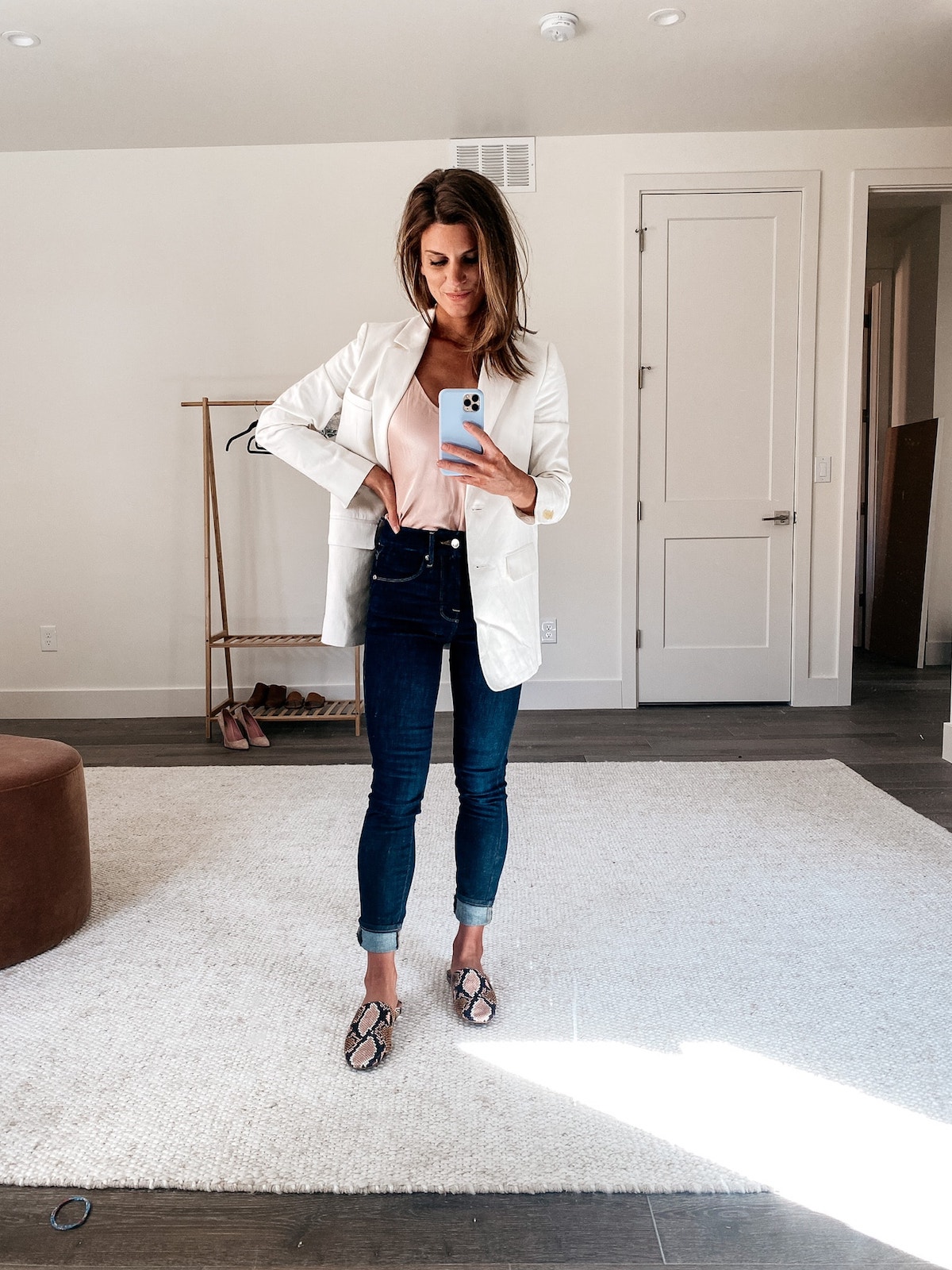 Brighton Keller wearing jeans, pink top and white blazer