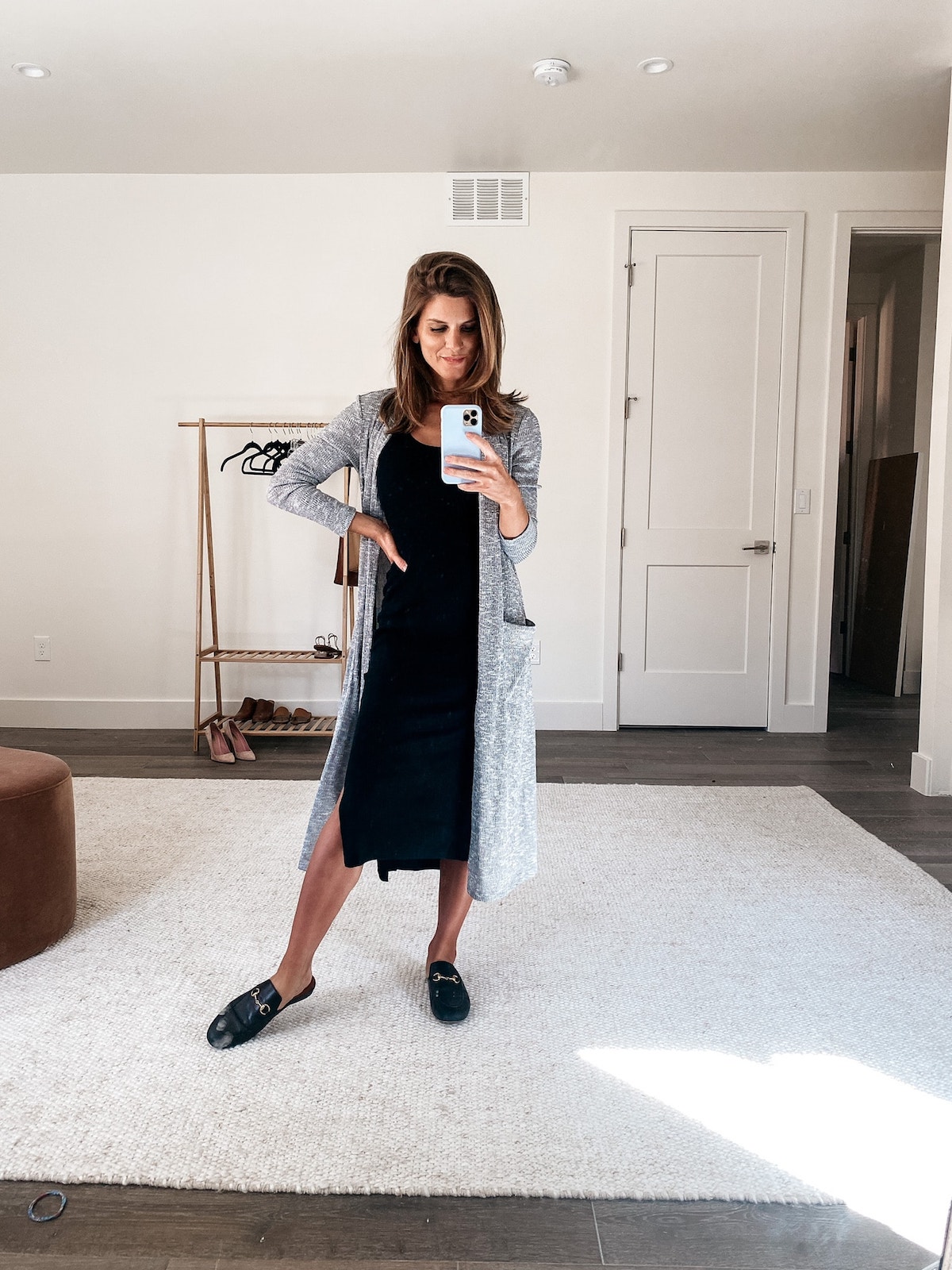 Brighton Keller wearing black dress, longline cardigan and slip-ons