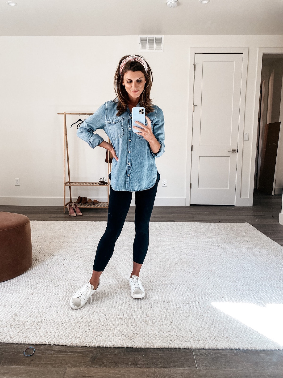 Brighton Keller wearing chambray shirt, black leggings and white sneakers