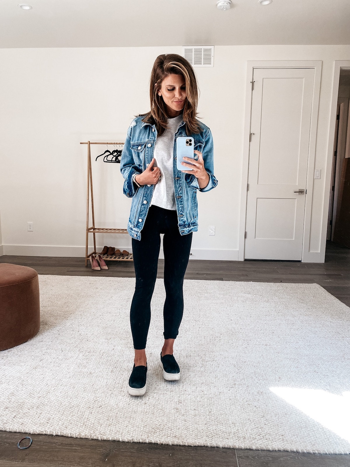 Brighton Keller wearing black leggings, chambray top, grey tee and black sneakers