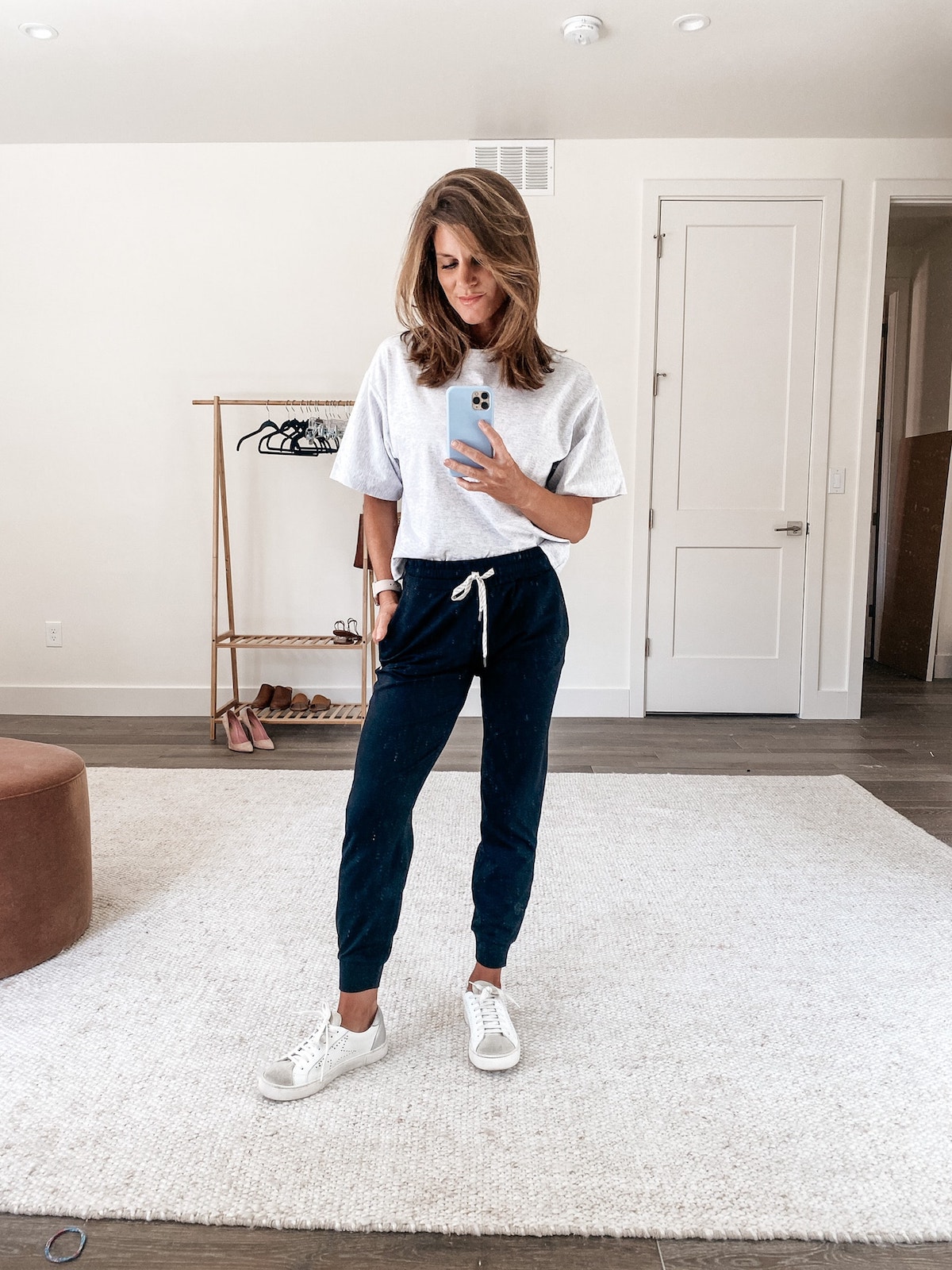 Brighton Keller wearing joggers, white sneakers and white tee