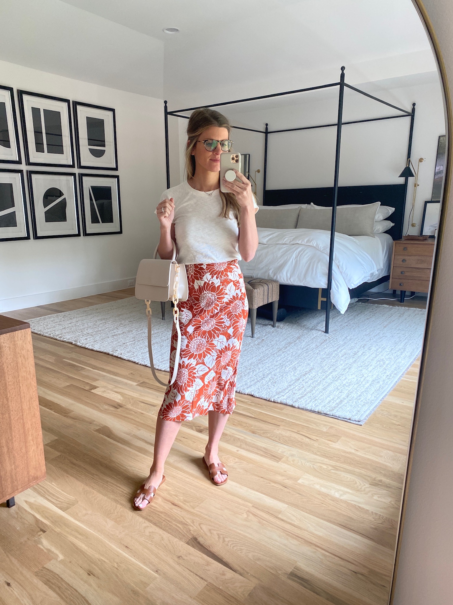 Brighton Butler wearing slip skirt floral from madewell and white tee and brown sandal from DSW