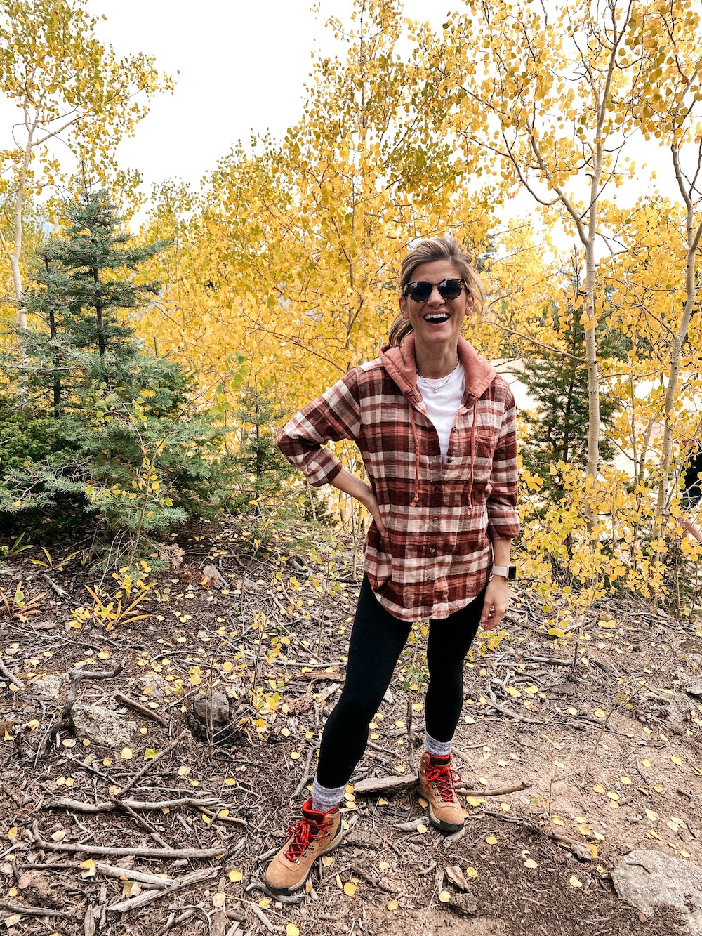 brighton butler mountain hiking outfit, plaid shirt wrapped around waist with leggings and hiking boots