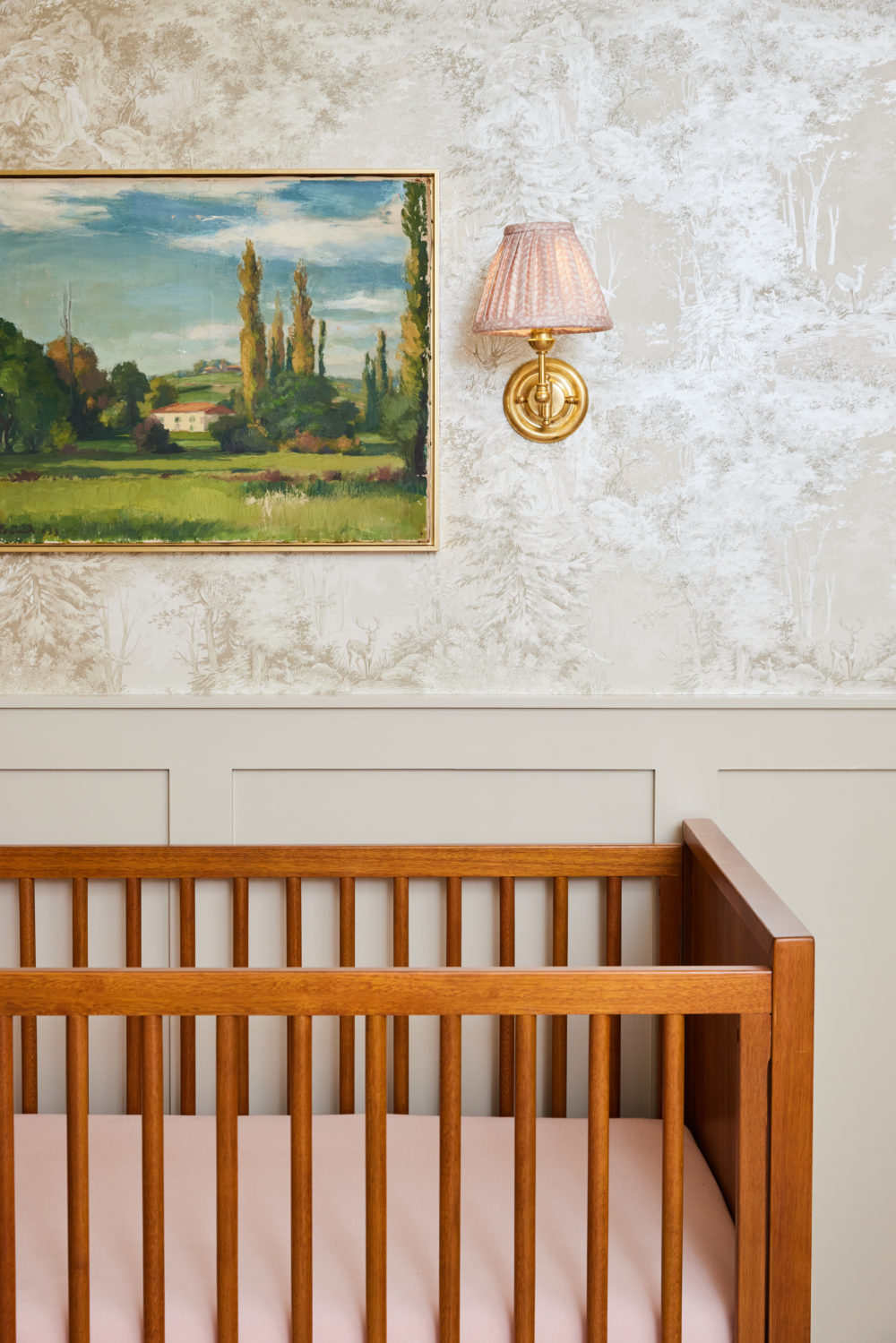 Brighton Butler Nursery Reveal, pink sconces over walnut crib 