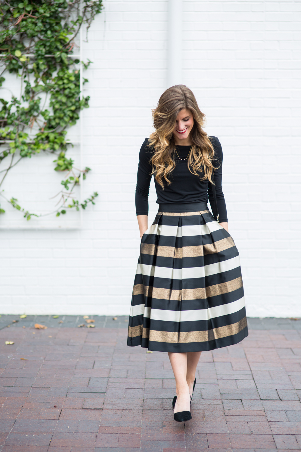 what to wear to holiday office party, holiday office party outfit idea, what to wear to company christmas party, midi skirt outfit, eliza j midi skirt with black turtleneck, kate spade bag, statement necklace