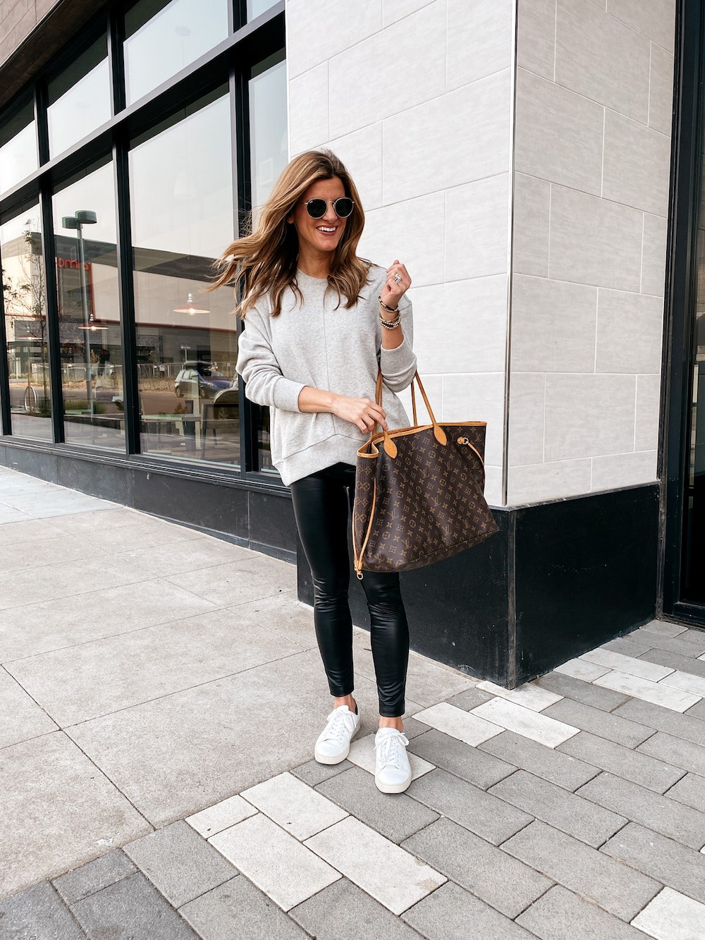 how to style white sneakers, white sneakers outfit, grey sweatshirt, black faux leather leggings, white fry sneakers, how to style white sneakers