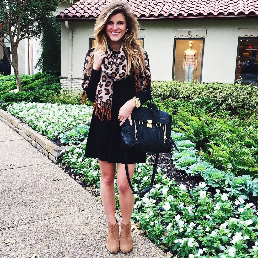 Long-sleeve black swing dress and leopard scarf via @brightonkeller