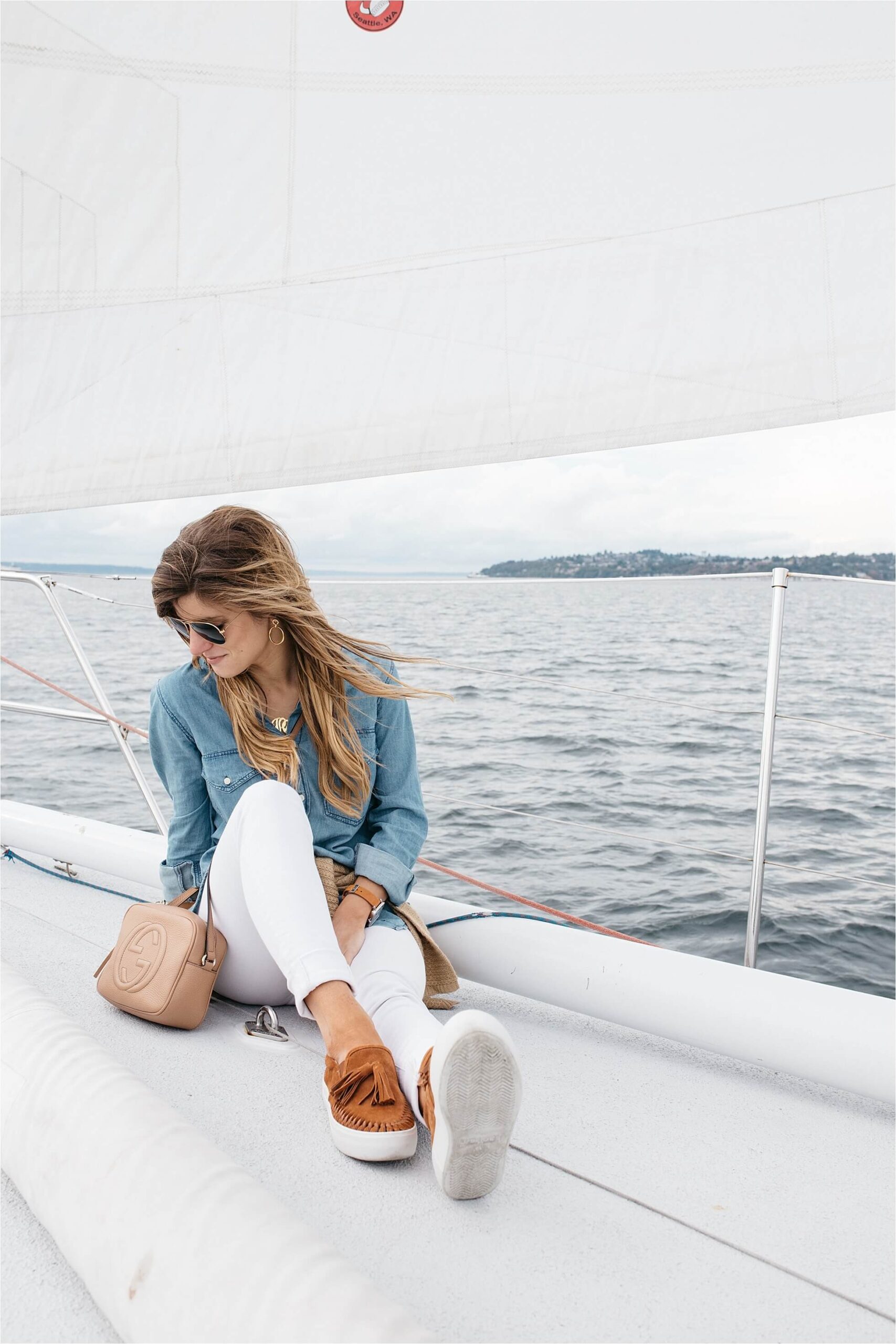 sailing in Seattle with lets go sailing wearing white jeans, chambray shirt, Jslides cognac suede slip-ons, monogram necklace and aviators, sailing outfit, what to wear sailing in seattle in late august