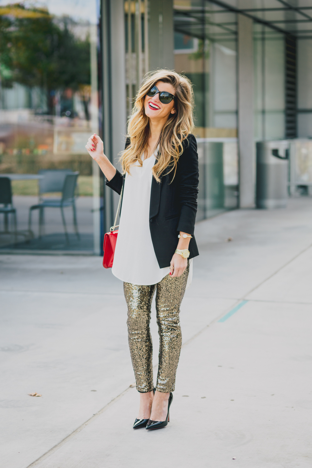 holiday outfit with gold sequin pants, white tunic blouse, black blazer, christian louboutin SO KATE heels