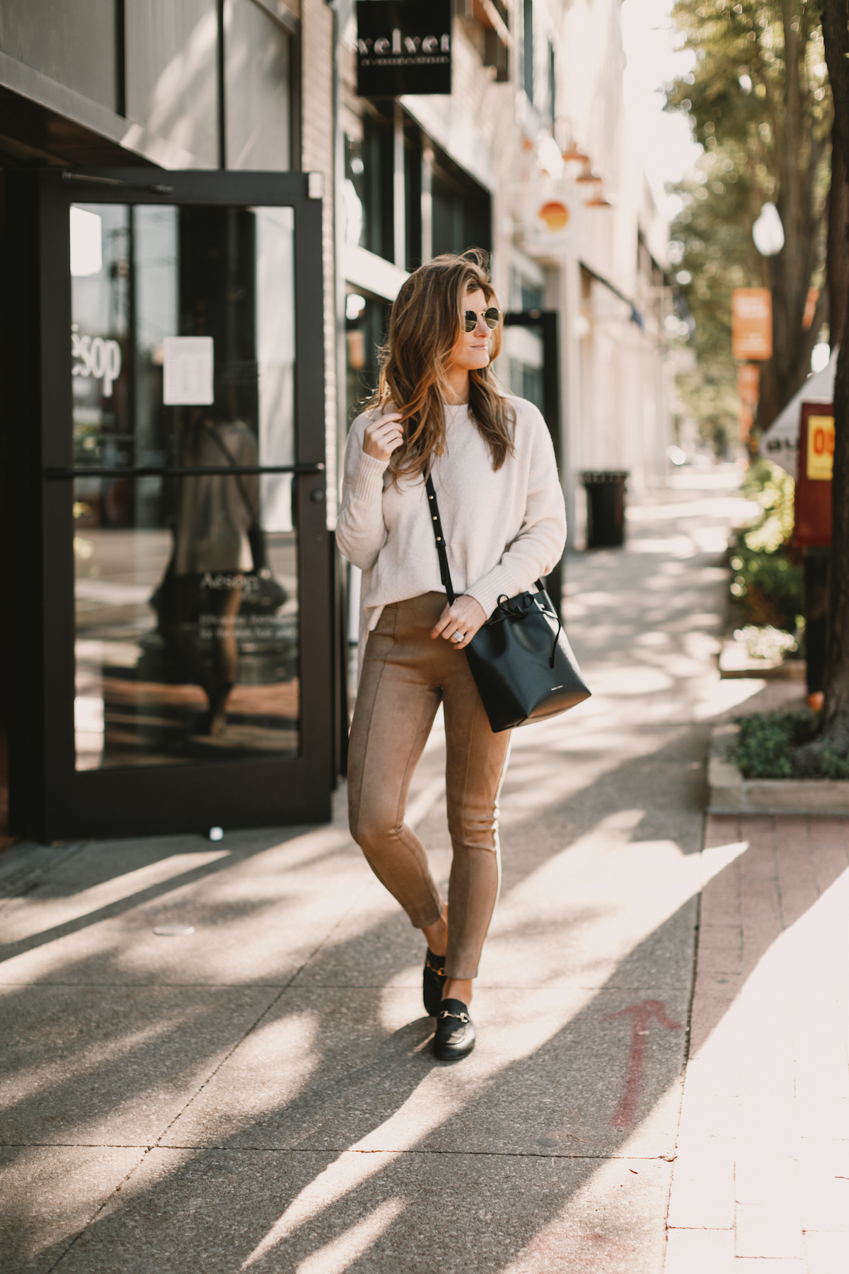 Brighton Butler wearing Spanx Suede Leggings with Sweater and Gucci Slides